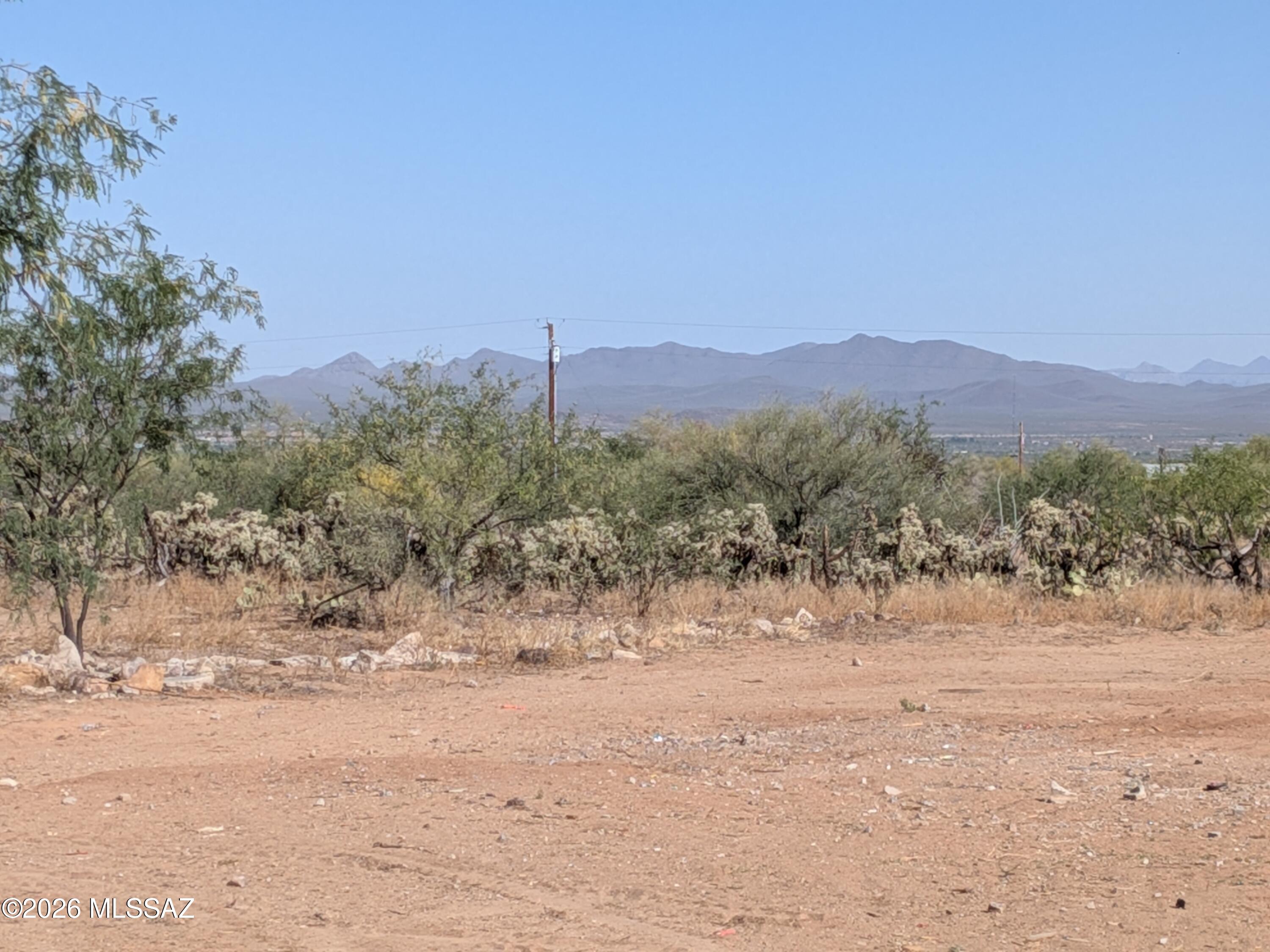 4.84 acre desert lot with essential utilities already in place, including a new water meter, electric panel, and septic system.   This desert lot is perfect  for your custom or manufactured home. Stunning mountain views, perfect for enjoying sunrises, sunsets. Paved roads allow for easy access.  The lot has graded areas where all original structures have been removed.  This listing includes Lots 301-75-008L and 301-75-008M that are in the process of being combined with Pima County.  The Seller can Close Escrow as soon as Pima County process is completed.
Water is Rancho Sierrita Well Association, not the City of Tucson Water. 
Seller will review Offers on May 18.