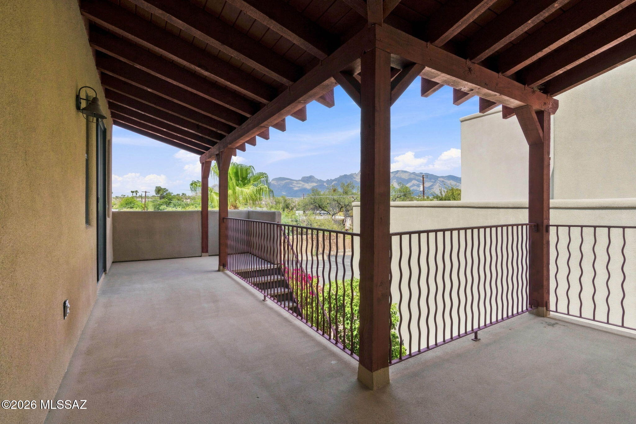 Stunning 4BR/4BA two-story home behind the gates of Miramonte at the River, just steps from the Loop trail! Soaring ceilings and an open great room welcome you, including new tile flooring for easy care. The island kitchen shines with granite counters, breakfast bar, and an abundance of cabinetry. The primary suite offers dual vanities, soaking tub, and separate shower, while private guest quarters with a separate entrance add flexibility for guests or multigenerational living. New water heater and newer HVAC bring peace of mind. Large balcony frames gorgeous Catalina Mountain views. Paver patio, BBQ area, low-care landscaping, and 2-car garage. Community features pool, spa, park, & more! With thoughtful updates, a versatile floor plan, and easy-care outdoor living just steps from the Loop, this home delivers the best of Tucson living.