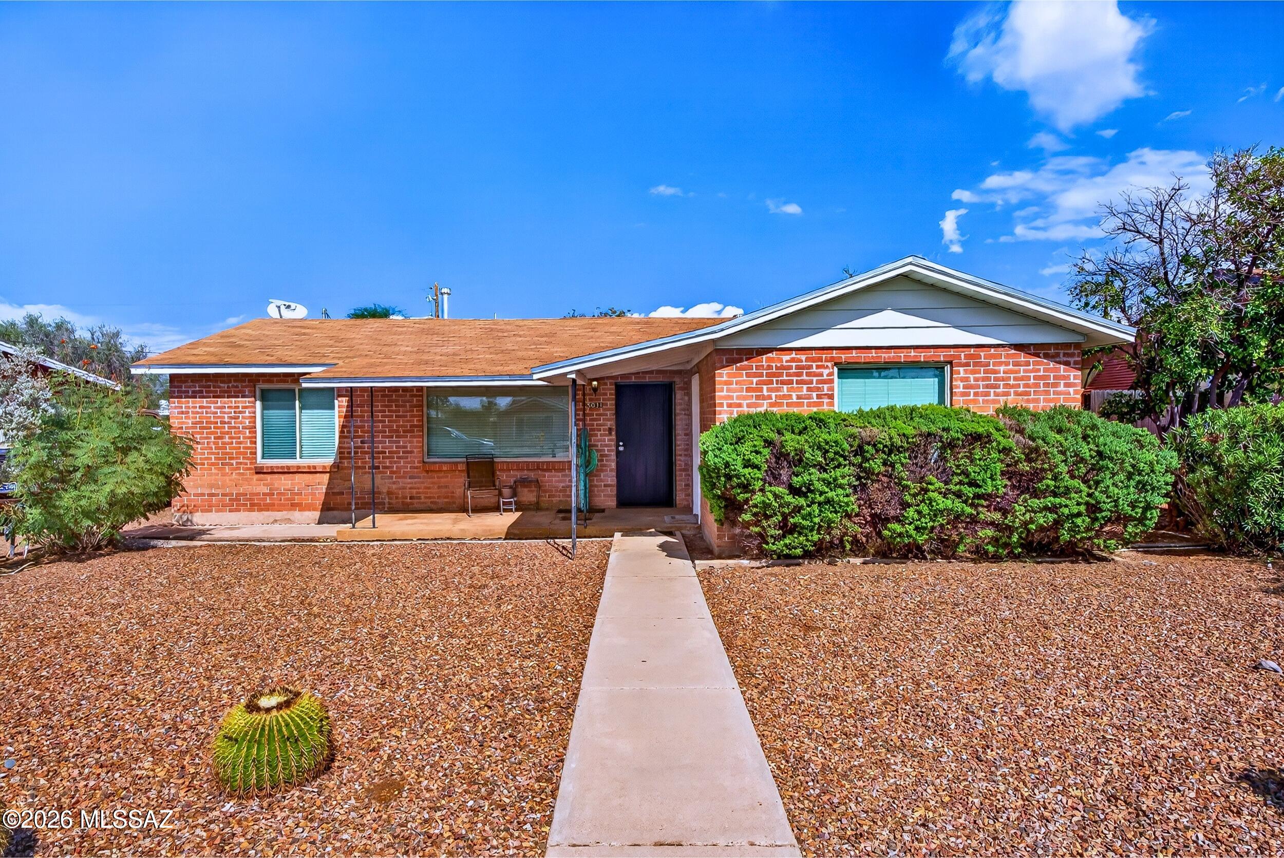 Charming central Tucson brick home with a separate guest house! With 1540 total sq. ft., this property combines comfort, versatility, and Southwest charm. The main home features 3 bedrooms, 1 bath, abundant natural light, tile and wood flooring, and a spacious living and dining area. The detached 325 sq. ft. guest house offers a private bath, kitchenette, and flexible living space, ideal for guests, a home office, or creative retreat. Enjoy low-maintenance desert landscaping, a welcoming covered patio, and both homes have a private backyard perfect for outdoor entertaining. Conveniently located near shopping, dining, and all that central Tucson has to offer. A wonderful opportunity with endless possibilities! Central Location offers easy access to shopping, dining and entertainment.