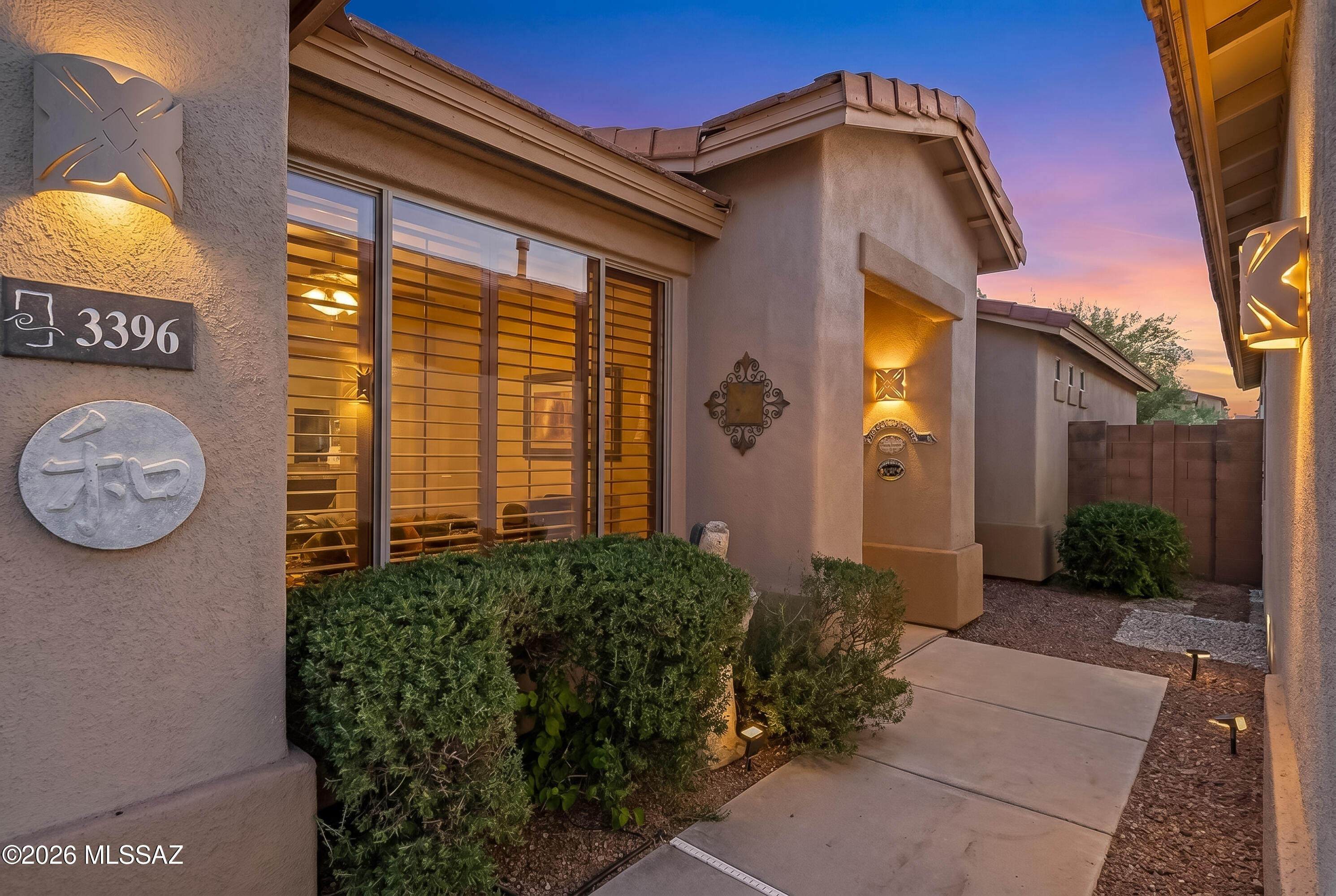Located in the private, gated community of Hacienda del Rio, this southwest contemporary home has been lovingly maintained and features 2 bedrooms plus an office/den space that is large enough to easily be converted to a third bedroom, plantation shutters, newer AC and water heater, and all appliances stay. The floor plan features an open kitchen concept to the generous size family room, island with breakfast bar seating, and spacious primary bedroom with en-suite bath, large, custom walk-in closet. Private backyard with ample shade from covered patio and trees & plantings. This neighborhood offers private pedestrian access to the Bashas' shopping center, and The Loop! Located right across the street from the community pool. Incredibly convenient central location, close to all amenities.