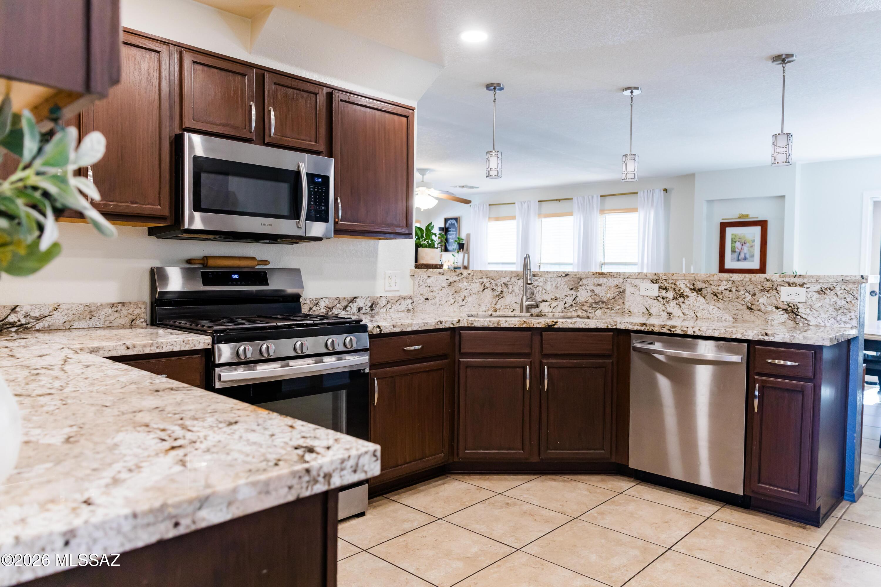 Don't miss this move in ready 3 bedroom, 2.5 bath two-story home in Julian Ranch, ideally located near Davis-Monthan AFB, Raytheon, and I-10.

The open concept main level offers a seamless flow between the living room, kitchen, and dining area. It's great for everyday living and entertaining! 

The updated kitchen shines with granite countertops, abundant cabinet and counter space, a breakfast bar, stainless steel appliances, and a gas stovetop.

Upstairs features all 3 bedrooms, 2 full bathrooms, and a conveniently located laundry room.

Schedule your showing today!