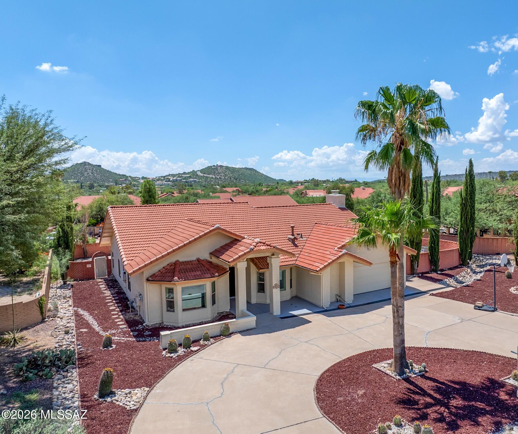 Welcome to this beautifully remodeled home in the desirable Sabino Clusters community. This spacious great-room floor plan features a formal dining room, inviting living area, covered patio, and a private backyard oasis on an expansive 0.44-acre lot. fully owned solar system, a new roof installed in 2023, and a brand-new HVAC system, interior paint, exterior paint, and a resurfaced pool--all completed in 2026. Additional upgrades include energy-efficient windows, wood-look ceramic tile flooring, ceiling fans, pool fencing, plantation shutters, and granite countertop.
The updated guest bathroom features an updated shower, while the kitchen offers a charming built-in wine bar. With numerous custom features and an exceptionally low HOA fee of only $11 per month, move-in-ready for you to enjo