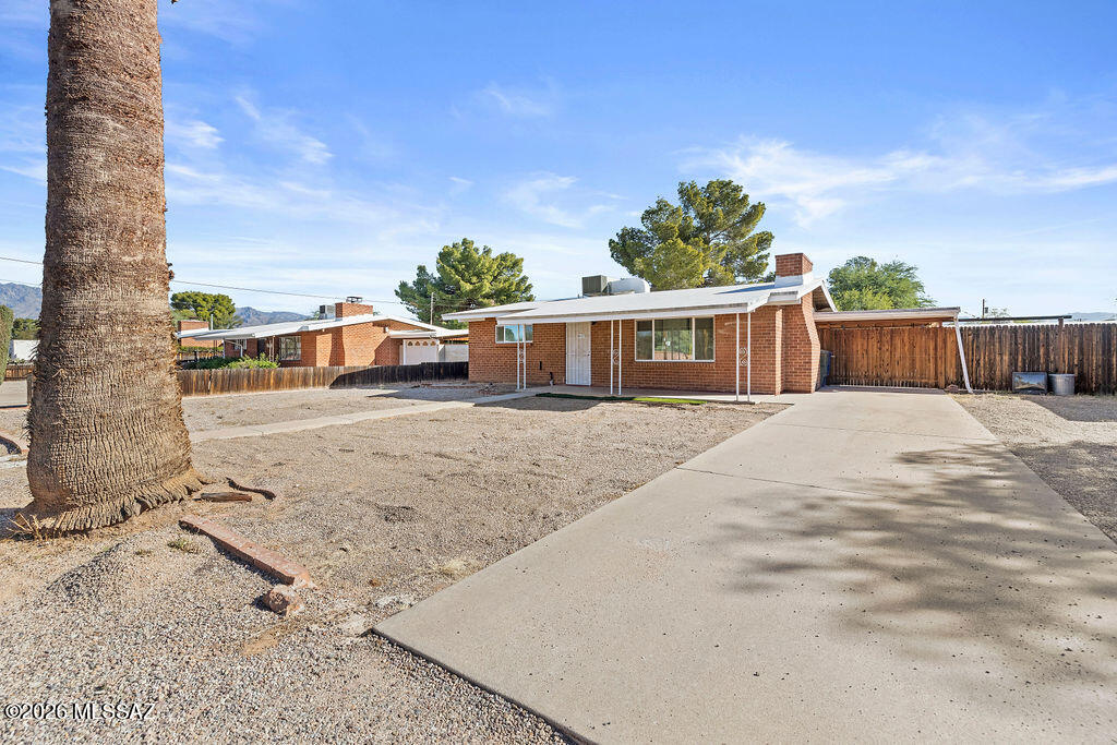 The perfect blend of mid-century charm and modern updates... this inviting 2-bedroom, 1-bath home offering 1,168 sq. ft. of comfortable living space. Wood-look plank tile flooring flows throughout, complemented by newer vinyl windows for improved efficiency, while the original character of the kitchen and bathroom has been thoughtfully preserved. One of the bedrooms features an additional full-size bonus room, providing the flexibility for a home office, hobby room, or expanded closet space. Outside, enjoy a full-length covered back patio overlooking the spacious backyard, complete with a storage shed and an additional storage room for all your tools and equipment. A covered carport along with space for an rv adds everyday convenience. Close to restuarants, shopping, and a convenient drive to the U of A makes this home an excellent opportunity for first-time buyers, downsizers, or investors alike. Owner/Agent.