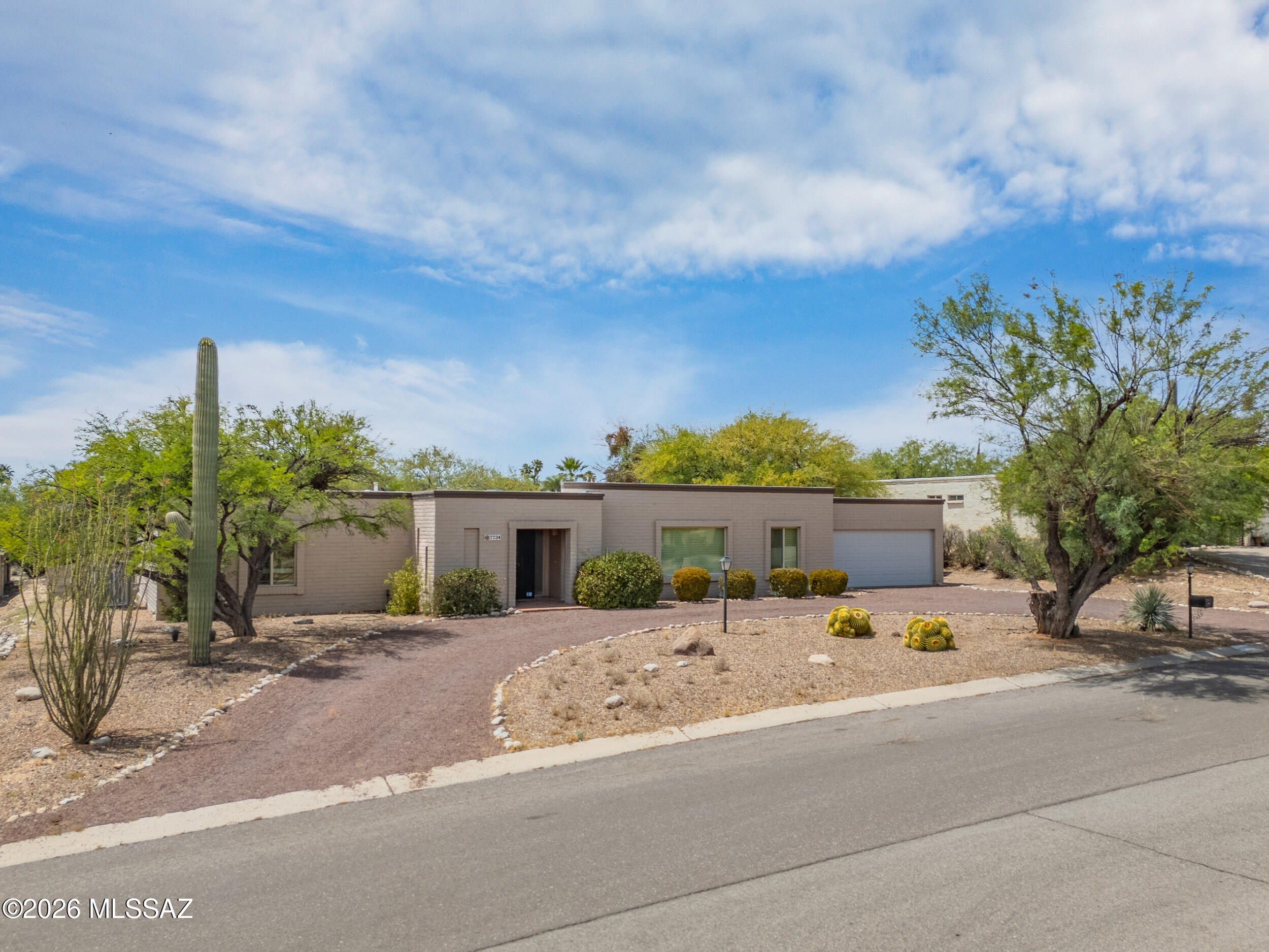 ''This Sabino Vista Knolls treasure radiates care and character at every turn. Thoughtfully updated throughout, it features a gorgeous backyard with an expansive covered porch and sparkling pool -- made for Arizona evenings. The refreshed kitchen shines with white cabinetry, granite countertops, double ovens and a 5-burner cooktop. A sun-drenched breakfast nook frames backyard views. The family room anchors the home with a welcoming beehive fireplace, perfect for gathering. The generous primary suite offers a renovated en-suite bath and exceptional closet space with a large walk-in. Two additional bedrooms share a beautifully updated guest bath. A convenient half bath and versatile bonus room off the kitchen flexes as a home office, craft room/gym. Exposed brick walls lend timeless charm.