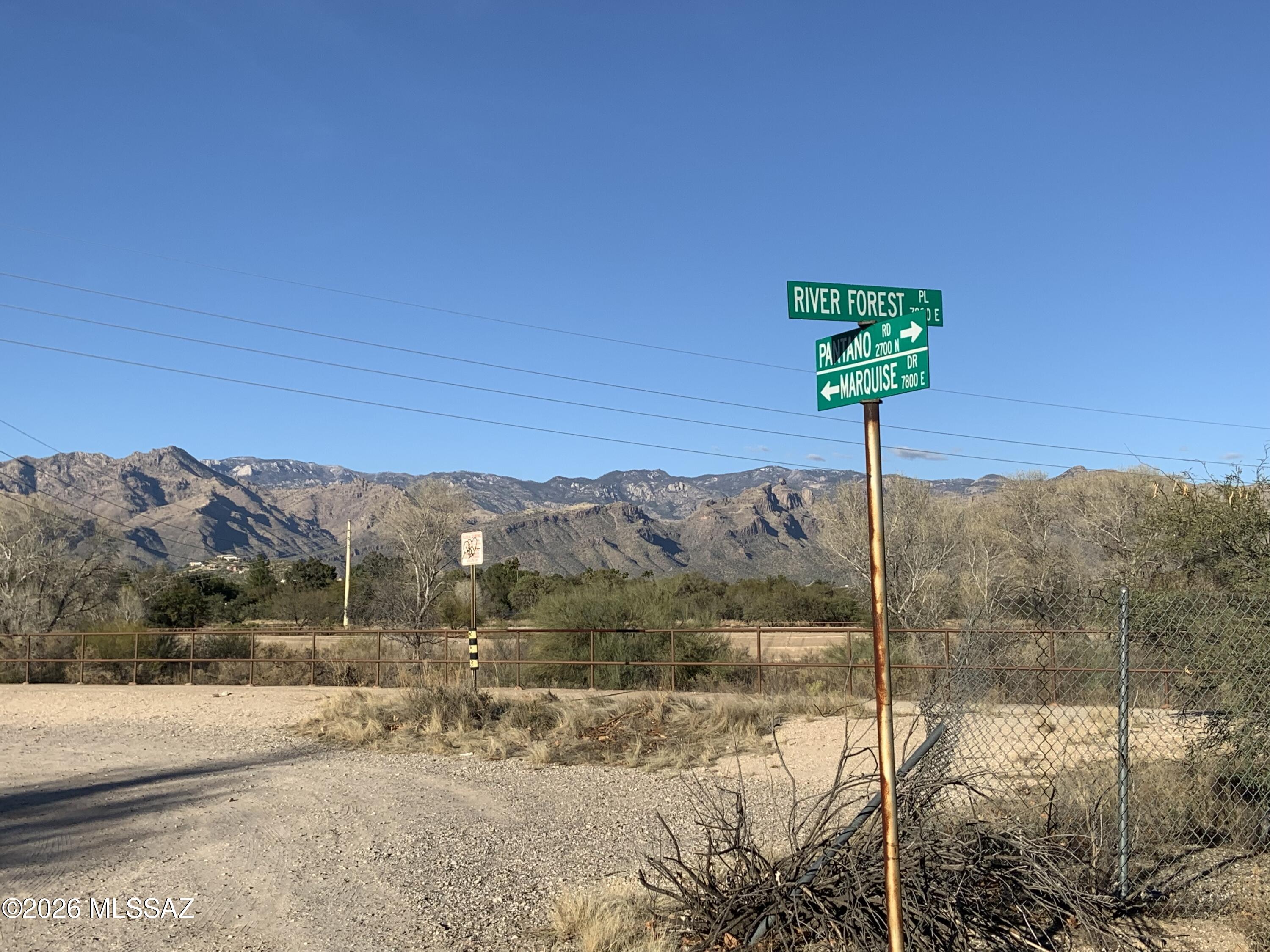 This one third of an acre lot is nestled in a forest of large mesquite trees. It was created back in 1998 thru a City of Tucson rezoning. The uniqueness of the property is preserved thru the native plant  preservation plan, design guidelines and CC&R's. The two newer homes suggest a community value for a new home of $800K. This is your opportunity to work with a custom builder and/or architect to create a home reflecting all of the innovations and design features currently being used in 2026. The location is just minutes from shopping, Udall Park, and boarders the Rillito loop bike train.
