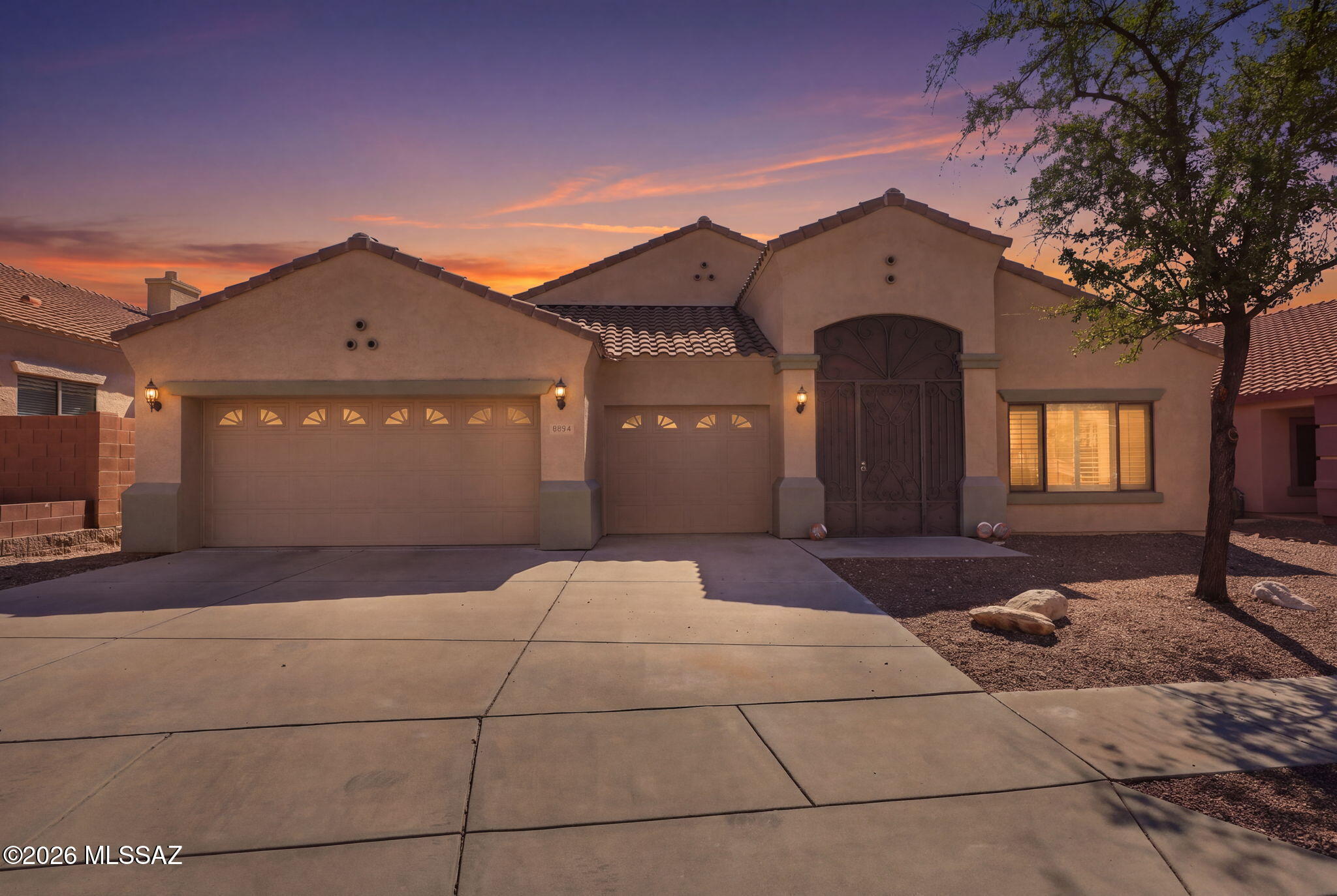 Tucked inside the gated community of River View Estates, this single-level home is ready to welcome you. Enjoy open space views and glimpses of the mountains, then gather in a kitchen made for sharing, with a granite island, newer cabinetry and stainless appliances. Cozy up by the fireplace on cool desert evenings, or step out to the covered patio, the perfect spot for grilling and entertaining. The primary suite is a true retreat with a soaking tub and walk-in closet. Recent updates include new carpet and exterior paint, and both A/C units have been replaced, so the big projects are already done. With four bedrooms, two and a half baths and a 3-car garage, there is room for everyone to spread out. A welcoming foyer opens to inviting living and dining spaces, and wired surround sound in the family room sets the stage for movie nights and game days. The kitchen's gas cooktop and double oven make cooking for a crowd a breeze, while a guest half bath and dedicated laundry room add everyday convenience. The third garage bay is perfect for a golf cart, hobbies or extra storage. Out back, the private fenced yard and flagstone patio are ready for morning coffee or evenings under the stars. A covered entry greets you at the front door, and an updated electrical panel, dual-pane windows, a tile roof and low HOA dues add comfort and peace of mind.