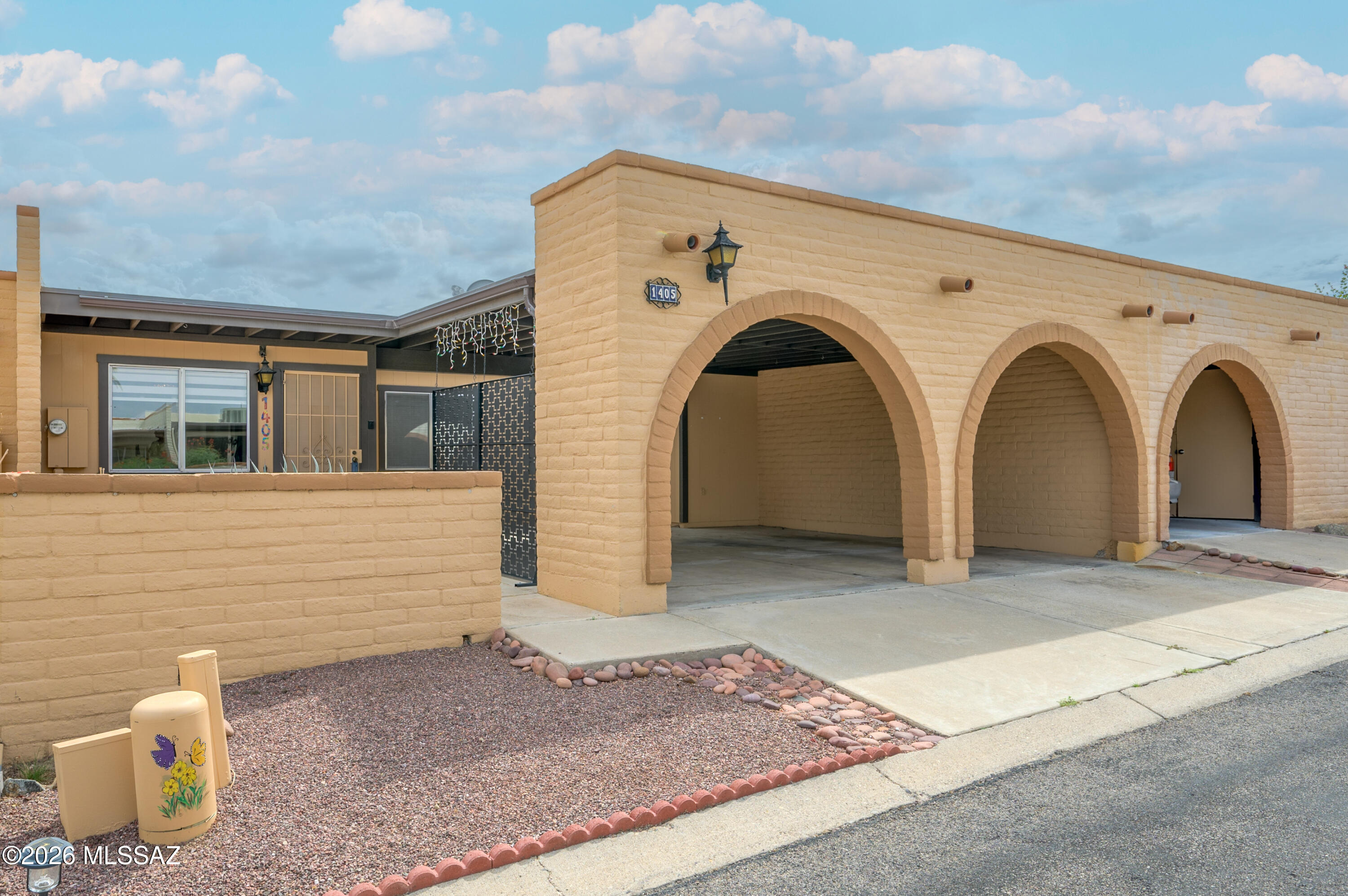 Charming 2 bed, 2 bath home located in the desirable Desert Hills community. This move-in-ready home features wood look ceramic tile flooring throughout, creating a stylish and low-maintenance living space. The spacious kitchen is beautifully appointed with granite countertops, a designer tile backsplash, ample cabinetry, and includes the LG washer and dryer. Ceiling fans in both bedrooms and the living area provide year-round comfort. The primary bedroom offers a spacious walk-in closet, while the guest bedroom features an enlarged closet for additional storage. This home is the perfect blend of modern updates, comfort, and convenience.