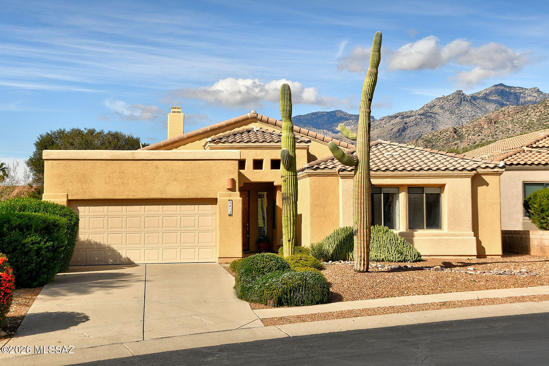 Set in a prestigious 24-hour guard-gated community on Arizona National Golf Course, this 2,036 sq ft contemporary home offers stunning mountain views, exceptional privacy, and backs to a natural desert buffer. The outdoor oasis features a Pebble Tec pool & spa (resurfaced 2025) & a large covered west-facing patio ideal for dining and BBQs. Inside, enjoy a bright open floor plan w/3 bedrooms, a den/office, 2 baths, high ceilings, a spacious great room with fireplace, & ceramic tile throughout. The open kitchen features gas cooktop, Corian counters, cherry-stained maple cabinets, breakfast bar, & island. Recent updates include Pool, Roof, Water softener, and RO system. Community amenities include Golf, Fitness center, Community pool, & proximity to hiking, biking, schools, & parks.
