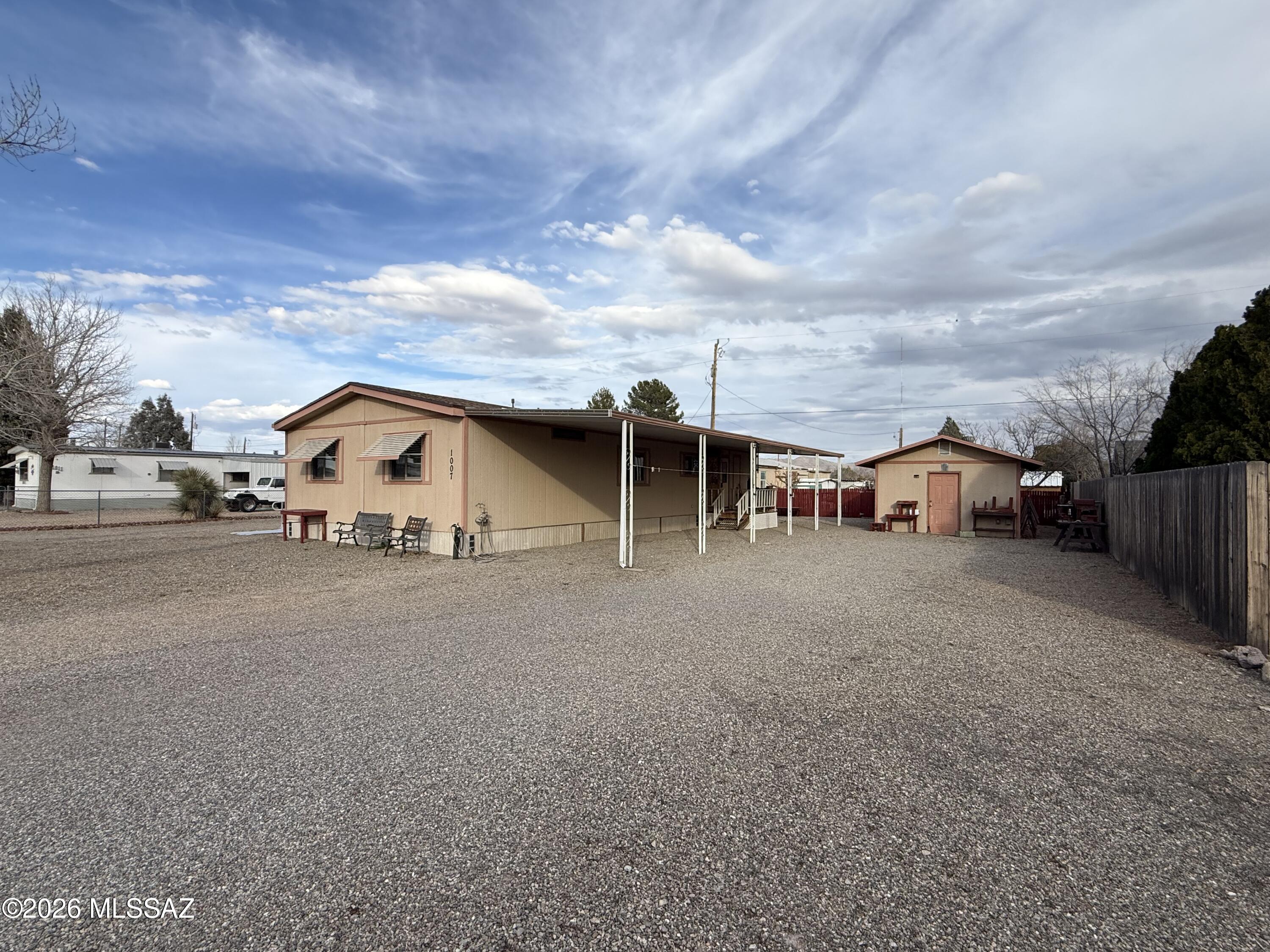 Very well cared for home that has three bedrooms, two baths.  Sitting on a very large double lot with a separate workshop that has electric.  Low maintenance yard, fenced on three sides.