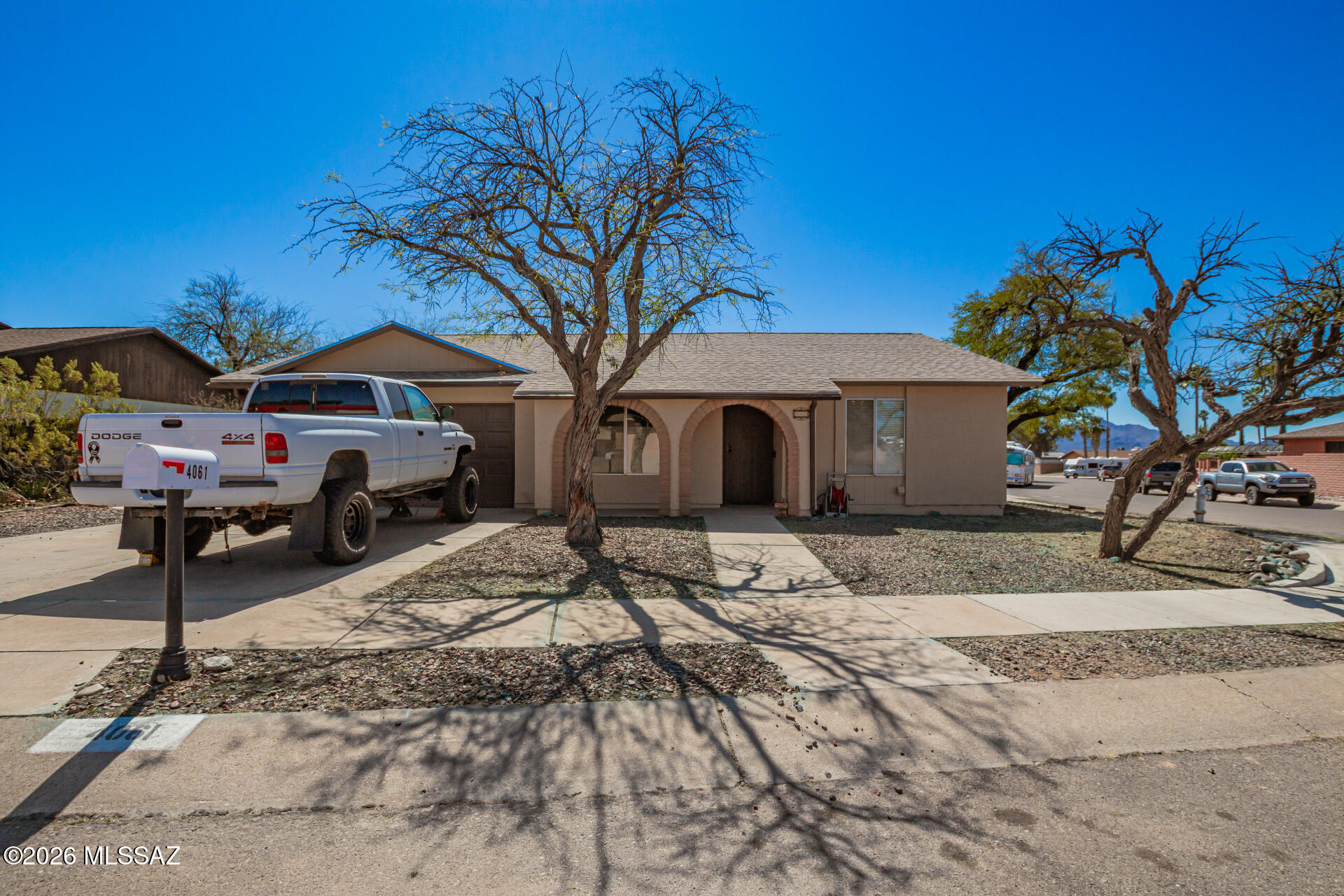 Welcome home to this wonderful ranch-style property in desirable Northwest Tucson! Situated on a spacious corner lot, this charming 3-bedroom, 2-bath home offers comfort, functionality, and thoughtful updates throughout. Step inside to find fresh interior paint and a warm, inviting living space highlighted by a cozy wood-burning fireplace, perfect for relaxing evenings. The home features a well-designed floor plan that flows comfortably for both everyday living and entertaining. Major improvements provide peace of mind, including a new HVAC system, roof replaced in 2018, and an updated electrical panel. The exterior has also been refreshed with fresh paint and a new back gate, enhancing both curb appeal and security. Outside, the corner lot offers extra space and flexibility... complete with an RV gate and RV hookups, making it ideal for storing recreational vehicles, trailers, or additional toys. A two-car garage adds convenience and additional storage. Located in a desirable Northwest Tucson neighborhood with beautiful desert surroundings, this home combines practical upgrades, outdoor versatility, and classic Southwestern charm. Don't miss the opportunity to make this well-maintained home your own!