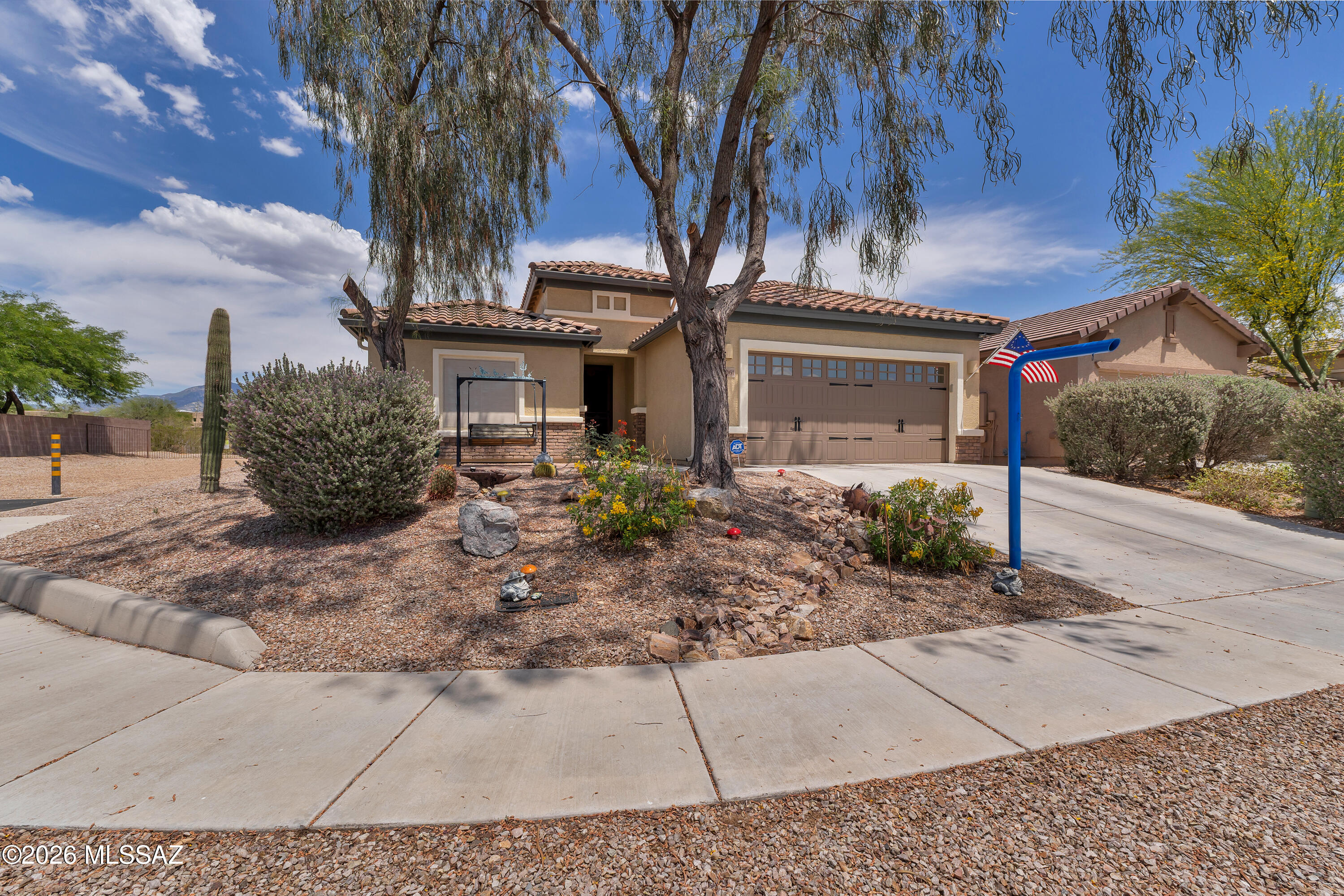 Beautifully upgraded 2BR/2BA home in the gated 55+ Rancho del Lago community. Features include fully paid solar, Bosch dishwasher, Navien tankless water heater, Water softener, RO system, plantation shutters, California Closet, Murphy bed, fresh interior/exterior paint, and insulated garage with epoxy floors. Enjoy the covered patio with ceiling fans, lighting, speakers, and mister system. Chiminea and BBQ convey. Community amenities include clubhouse, pools, horseshoes, putting green,pickleball courts, and numerous social activities. Move-in ready and designed for easy Arizona living.