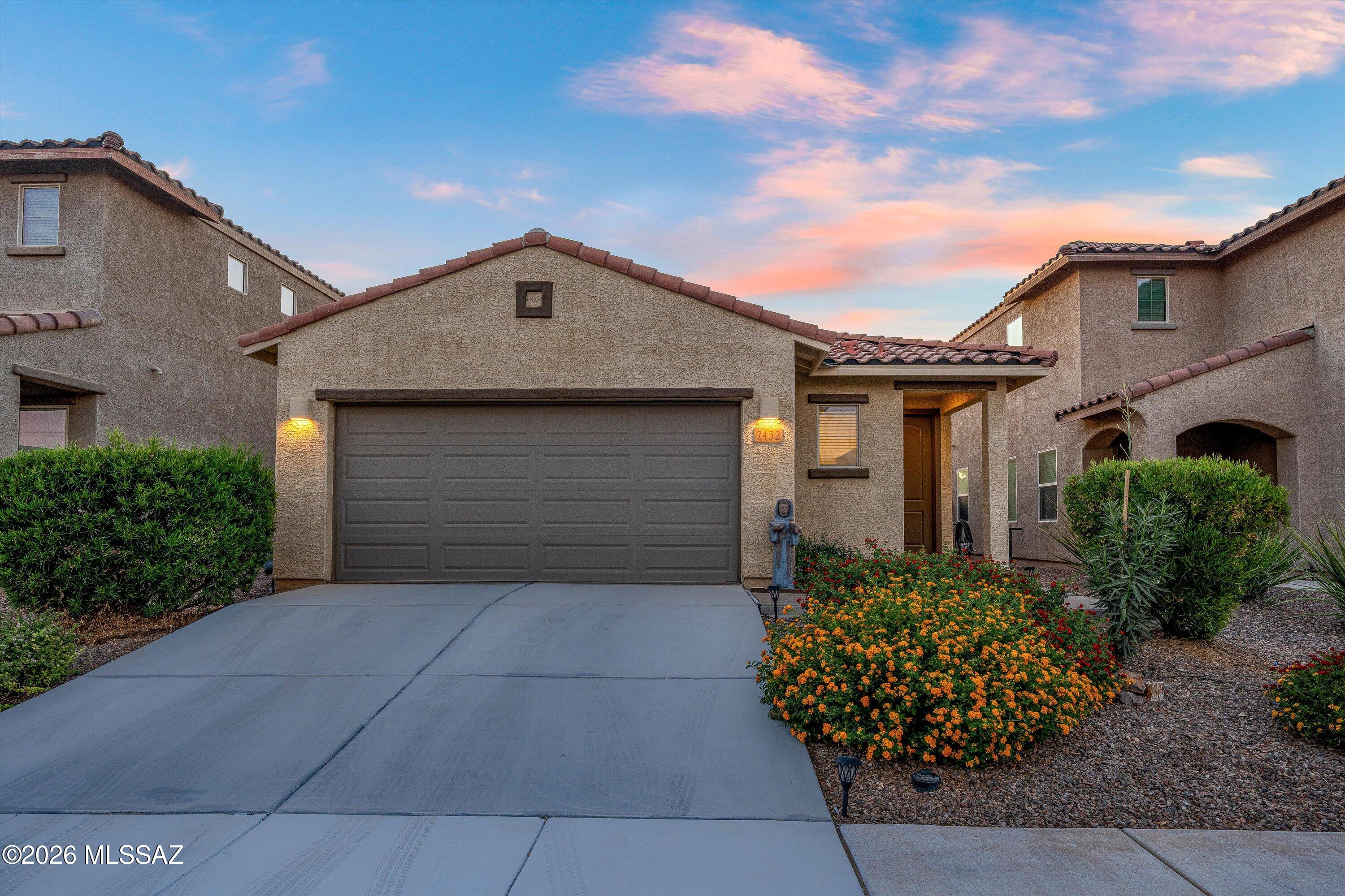 Welcome to La Estancia! This well-maintained 1,467 sq. ft. home offers 3 bedrooms, 2 bathrooms, and a 2-car garage in one of Southeast Tucson's popular master-planned communities.  The open-concept floor plan provides comfortable everyday living , while the thoughtfully designed backyard creates an inviting outdoor retreat.  Enjoy low-maintenance desert landscaping, a covered patio, and an additional shade sail-covered dining area-perfect for outdoor meals, entertaining guests, or simply relaxing and enjoying Arizona's beautiful weather.  Conveniently located near community parks, walking paths, shopping, dining, and major employers, this home combines comfort, convenience, and outdoor living.