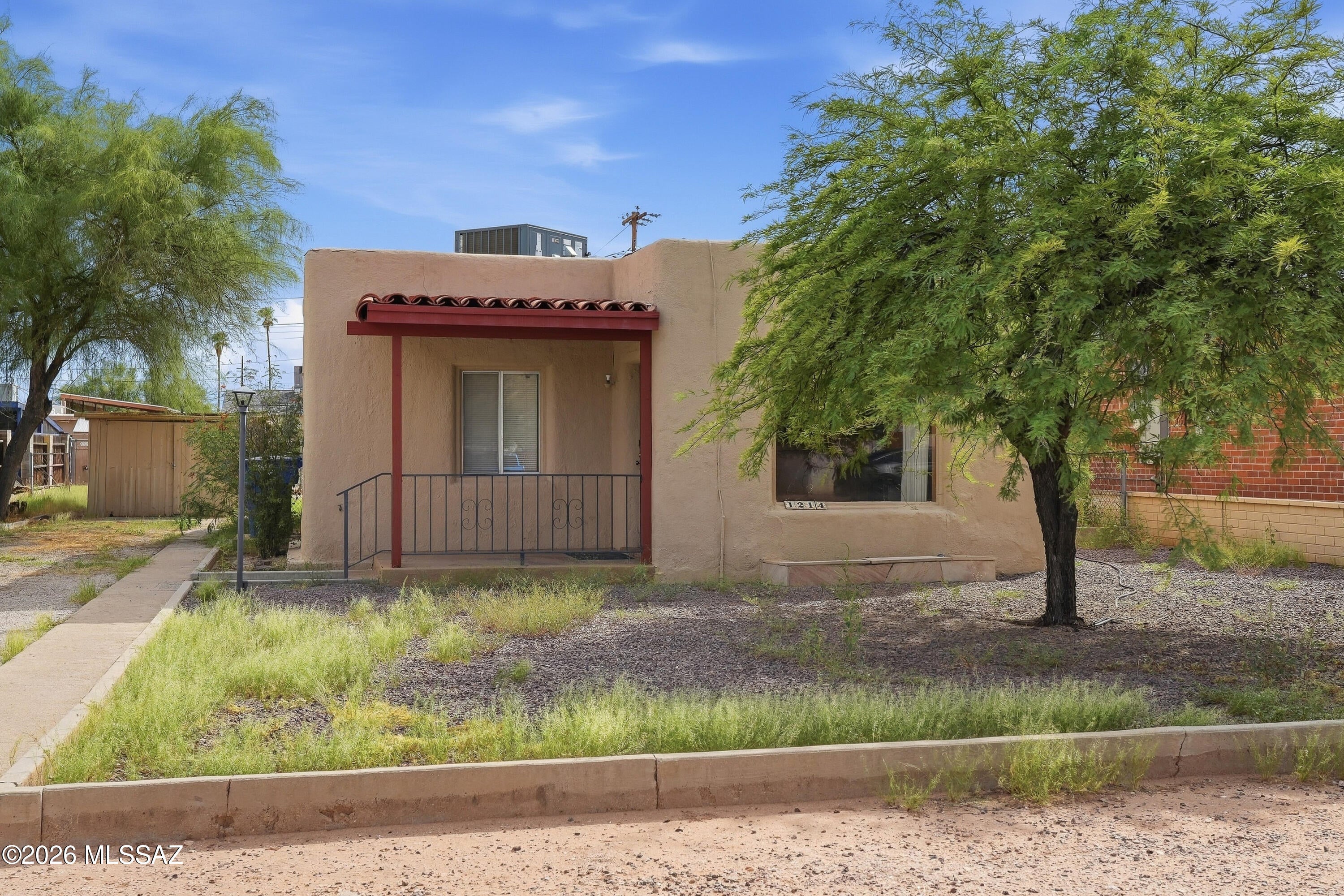 Enjoy comfortable Arizona living in this 2-bedroom, 1-bath home situated on a large lot with no HOA. The home features an Arizona room offering additional flexible living space, while the living room fireplace adds warmth and character. Natural desert landscaping provides an easy-care outdoor setting. Refrigerator, washer, and dryer are included for added convenience. With its spacious lot, functional layout, and desirable no-HOA setting, this home offers plenty of possibilities.