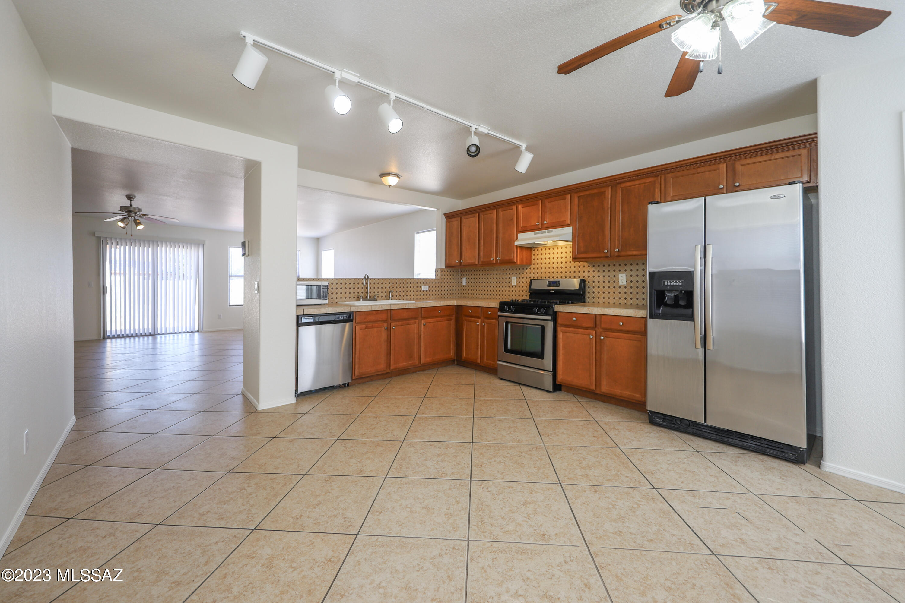 Spacious and beautifully upgraded 3-bedroom plus den home that can be utilized as a 4th bedroom or office in Midvale Park, conveniently located near shopping, dining, and major employers. The bright interior features diagonally laid tile flooring throughout (except 2 closets), stainless steel appliances, tile countertops, abundant cabinetry, and a pantry. The primary suite offers a private bath with a double-sink vanity and an oversized tiled shower with a built-in seat. Enjoy a two-car garage and a low-maintenance backyard with double-gate access.
