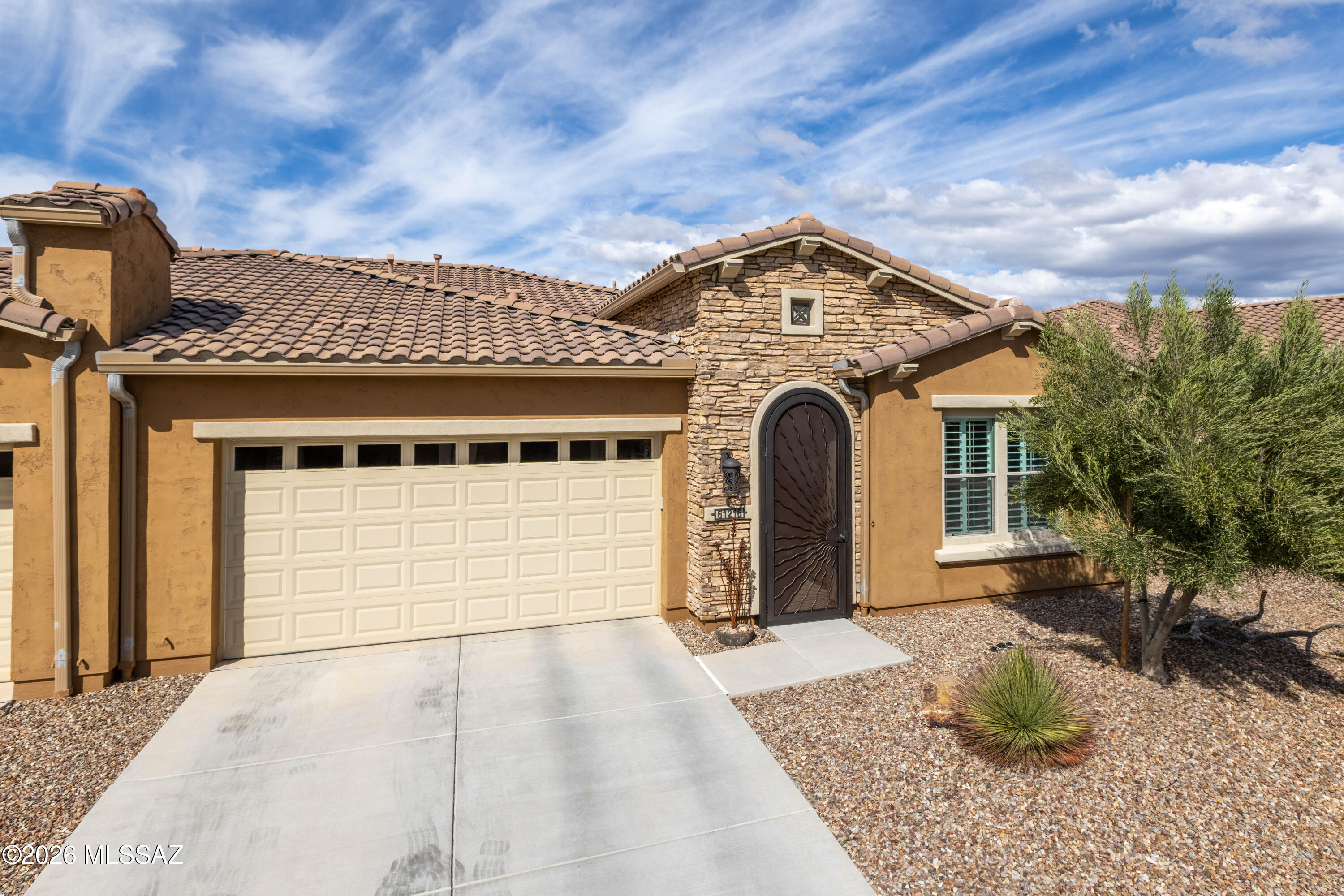 Luxurious upgraded Viva model in SaddleBrooke Ranch! 2021-built 2BR/2BA Villa with a den ! 1,655 sq ft of premium features. Chef's kitchen boasts 41'' upgraded cabinets, crown molding, quartz counters, Blanco sink, and upgraded backsplash. PARADIGM luxury vinyl flooring with plush bedroom carpet. Master suite features rain glass shower, comfort height toilets, walk-in closet with built-ins. Smart home amenities include dimmer switches, USB outlets, TV mounts. Outdoor paradise: extended arroyo (rare!), paver patio, turf courtyard, gas stub, rolling shades. Garage has Outdoor Creations coating, utility sink, custom storage, golf cart outlet. Home boasts upgraded appliances, plantation shutters, security doors. Perfect 55+ lifestyle!