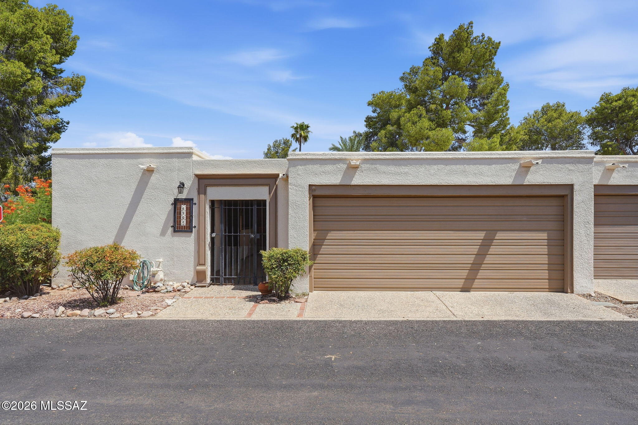 This 3BR 2 Bath Single Story Townhome in Dorado Country Club Estates awaits your personal touch. High Ceilings in Formal Dining Room and Living Room with Gas Fireplace and Sliding Glass Doors to Back patio. Large Eat in Kitchen with lots of cabinets overlooks Gated Covered Front Patio. Laundry Room with storage off Kitchen. Gas HVAC installed 2017, Gas Water Heater 2013. Spacious Two Car Garage. Monthly HOA covers Road Maintenance, front yard maintenance and Lovely Community Pool and Spa with Ramada Seating with Mountain Views. Perfect spot to enjoy Sunsets or early morning coffee and a swim. Conveniently located to shopping, restaurants, medical services and University of Arizona.