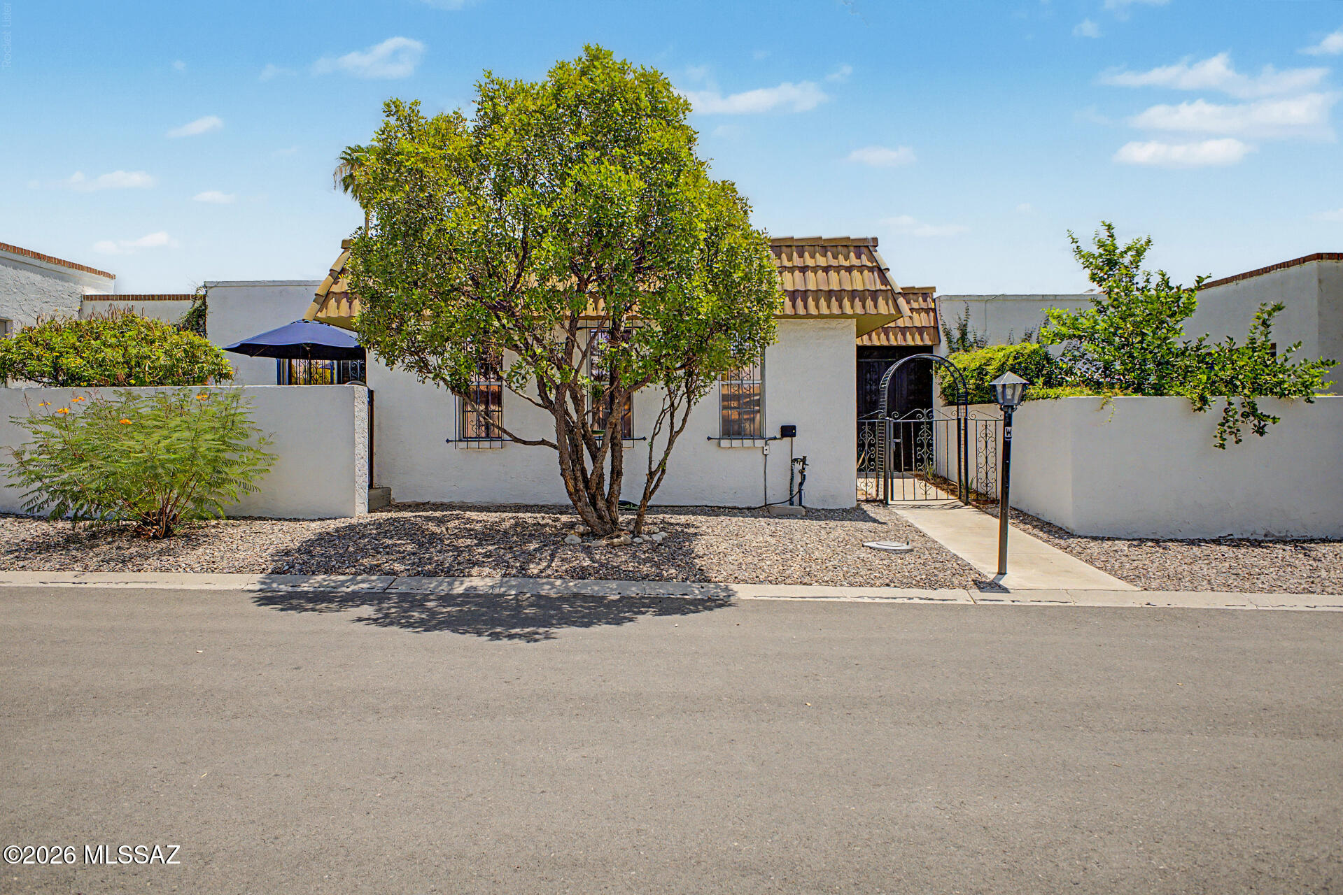 Seize the fantastic opportunity to own this lovely 2-bedroom, 2-bathroom townhome! Discover the inviting living areas ready to welcome you and your loved ones, featuring tile floors, abundant natural light, a kiva fireplace to keep you warm, and a neutral palette that creates a comfortable atmosphere throughout. Spotless kitchen complete with flat-panel cabinets, mosaic backsplash, quartz counters, and built-in essentials for a seamless cooking experience. The primary bedroom promises a good night's sleep, offering a private bathroom, a practical walk-in closet, and direct outdoor access. You can enjoy your morning coffee on the back patio and spend relaxing evenings. Don't forget to visit the community's pool and spa for a refreshing time! This home is a must-see!
