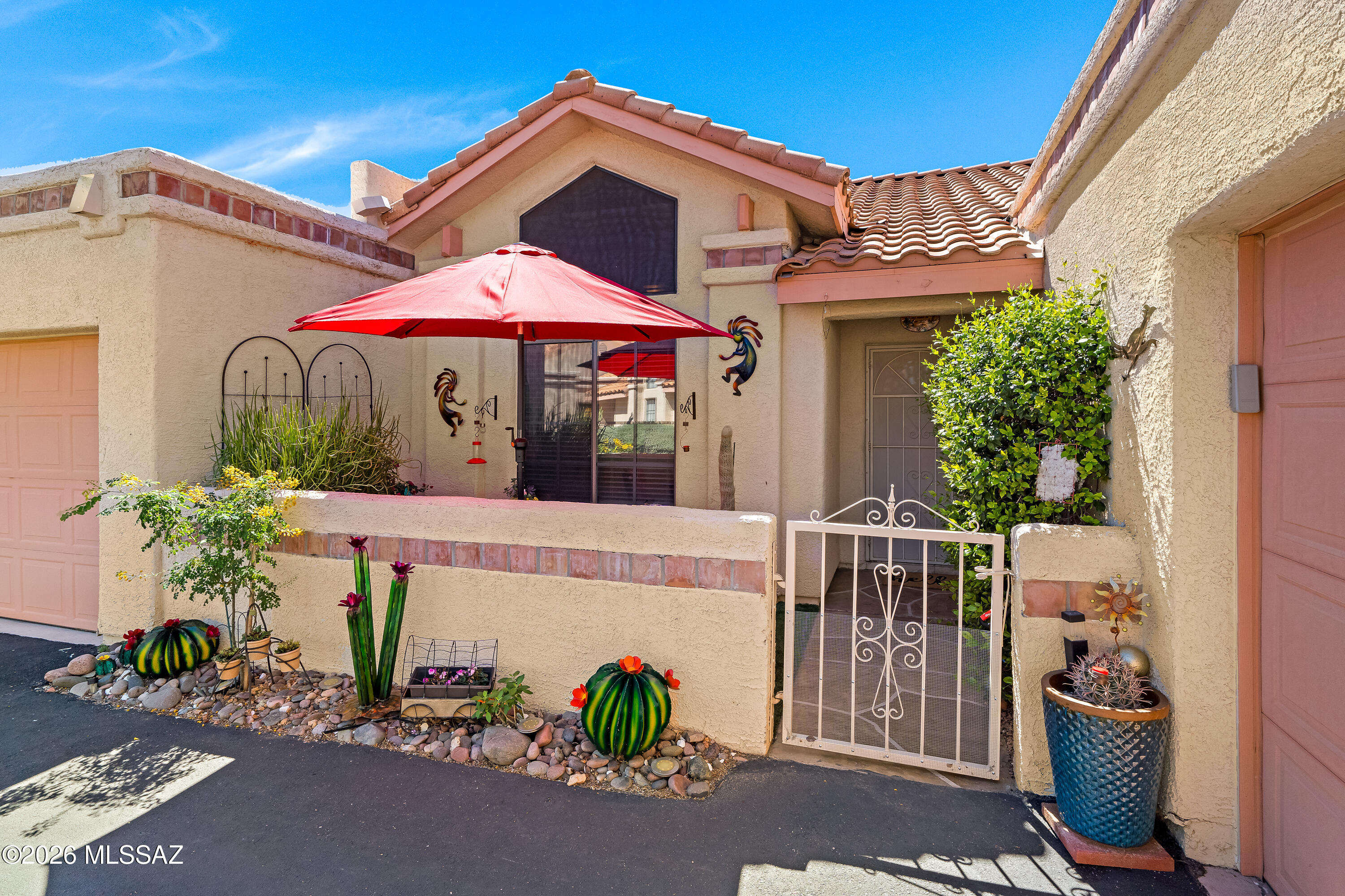 Stunning end Unit w/Breathtaking mtn views. Enjoy desirable light filled split plan w/spectacular views, open space & soaring ceilings. Elegant finishes include brick-pattern travertine, wd flooring, decorative shelving, updated fixtures & more! Spacious great rm showcases a striking stacked-stone FP & flows seamlessly into dining area & updated kitchen. Highlights include refinished cabinetry w/pull-out shelving, Silestone countertops, ext'd BF bar, stone sink & pantry. Inviting primary suite w/cove ceilings & beautifully remodeled bath w/exec height dual vanity, custom-tiled walk-in shower w//glass block & generous walk-in closet. Step outside to a private rear patio overlooking natural desert & stunning Pusch Ridge views. Add'l side patio borders common area for perfect desert living! Garage includes lots of built-in cabinetry, water softener & epoxy-coated floor. Nice community pool with lovely mountain views. Conveniently located near shopping, restaurants & more!  

See attached list for included furnishings