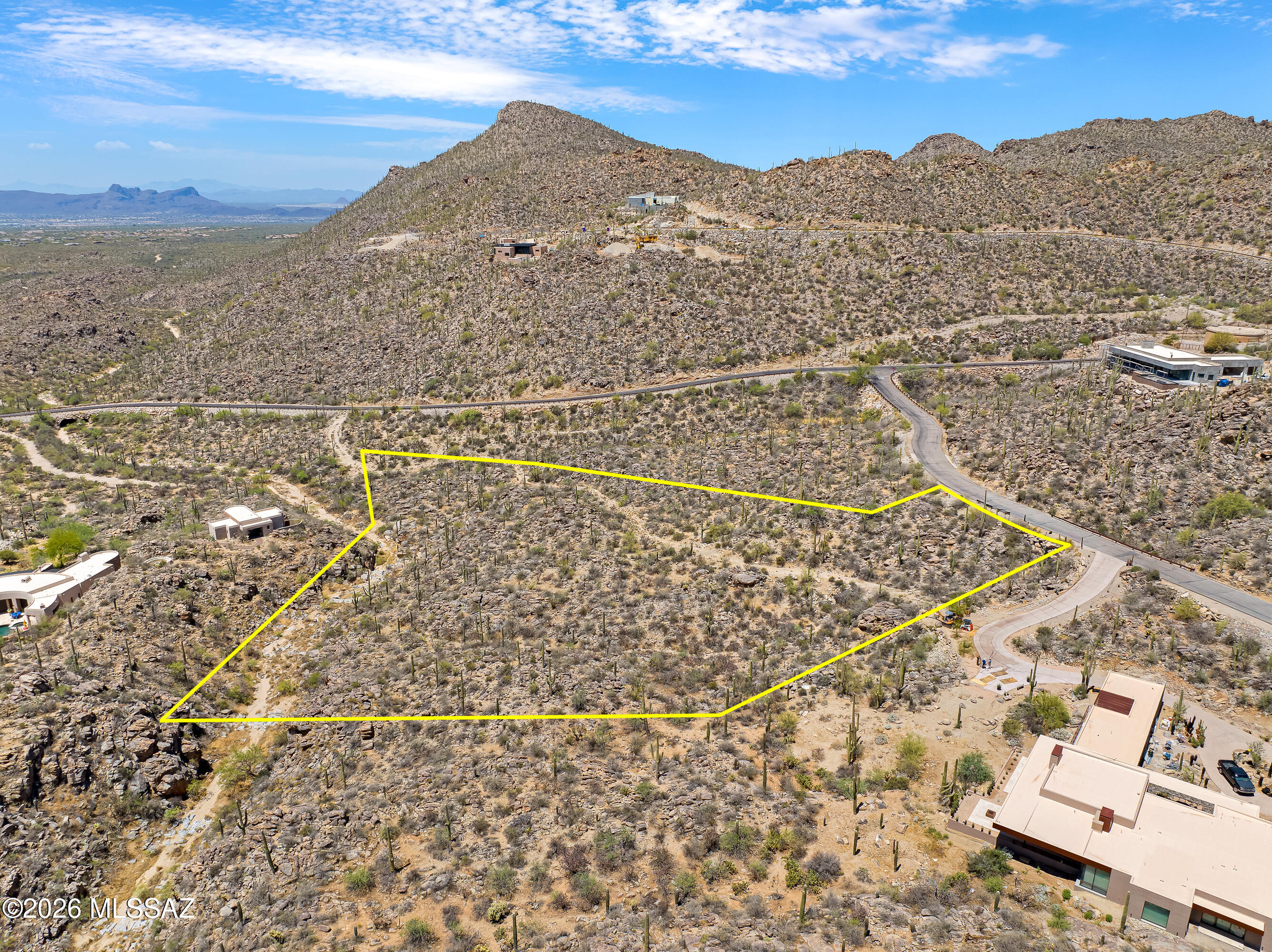 Exclusive Estate Homesite in Saguaro Ranch - Discover a rare opportunity to build your dream estate within the prestigious Saguaro Ranch, a remarkable 1,200-acre private desert sanctuary nestled within the Tortolita Mountains. With more than 80% of the land permanently preserved, Saguaro Ranch offers an unparalleled blend of luxury, privacy, and connection to the Sonoran Desert. This exceptional 4.21-acre homesite enjoys a prime location within the community--perfectly positioned midway between the iconic gated (through the mountain) entrance and the exclusive Owner's Club. Surrounded by dramatic rock outcroppings, towering saguaros, and sweeping mountain vistas, the property captures the essence of Arizona's most spectacular desert landscape. One of the most attractively priced and easily developed parcels available in Saguaro Ranch, this homesite provides an ideal canvas for creating a custom luxury residence while preserving the serenity and natural beauty that define the community.
Residents enjoy access to the renowned Owner's Club, featuring a social center, fitness facilities, resort-style pool with swim-up bar, pickleball and bocce ball courts, and miles of scenic hiking and walking trails that wind throughout the preserved desert terrain.

Ideally located near Tucson's premier golf destinations, including The Golf Club at Dove Mountain, The Highlands at Dove Mountain, and The Gallery Golf Club, the property also offers convenient access to world-class resort amenities at The Ritz-Carlton, Dove Mountain. Outdoor enthusiasts will appreciate the abundance of nearby hiking opportunities, with more than nine scenic trails just minutes away.

The shopping, dining, and conveniences of Oro Valley are close at hand, while easy access to Interstate 10 provides seamless connectivity throughout Southern Arizona.

Experience a lifestyle defined by privacy, serenity, and extraordinary natural beauty in one of Arizona's most coveted luxury communities. This is more than a homesite--it's an invitation to create your own desert paradise.