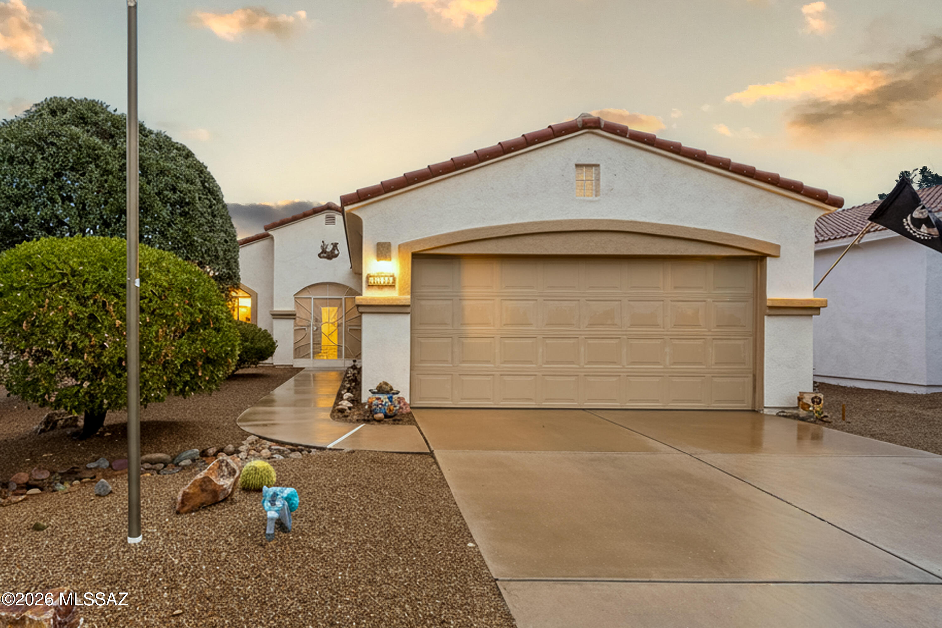 Wake up every day to breathtaking Santa Rita Mountain views from your living room, dining area, kitchen, and primary suite, then exit outside to your private back patio and enjoy the scenery morning, noon, and night. Located in the desirable Legends community, this extremely well-maintained single-family home is truly move-in ready and designed for easy, enjoyable living.

This 3-bedroom, 2-bath home offers a bright open layout with tile flooring in the main living areas, carpet in the bedrooms, and vinyl wood flooring in one of the rooms, perfect for a guest space, hobby room, or home office. The kitchen will impress with newer stainless-steel appliances, quartz countertops, generous counter space, pull-out cabinetry, and a pantry closet for extra storage. Whether you're preparing - preparing a quiet meal at home or hosting friends, the kitchen and breakfast bar flow beautifully into the main living areas, making entertaining effortless.
The spacious primary suite is a relaxing retreat featuring a large closet and a walk-in shower. Additional bedrooms provide flexibility for guests or everyday living. Some furnishings may convey, allowing you to settle in quickly and start enjoying the lifestyle right away.