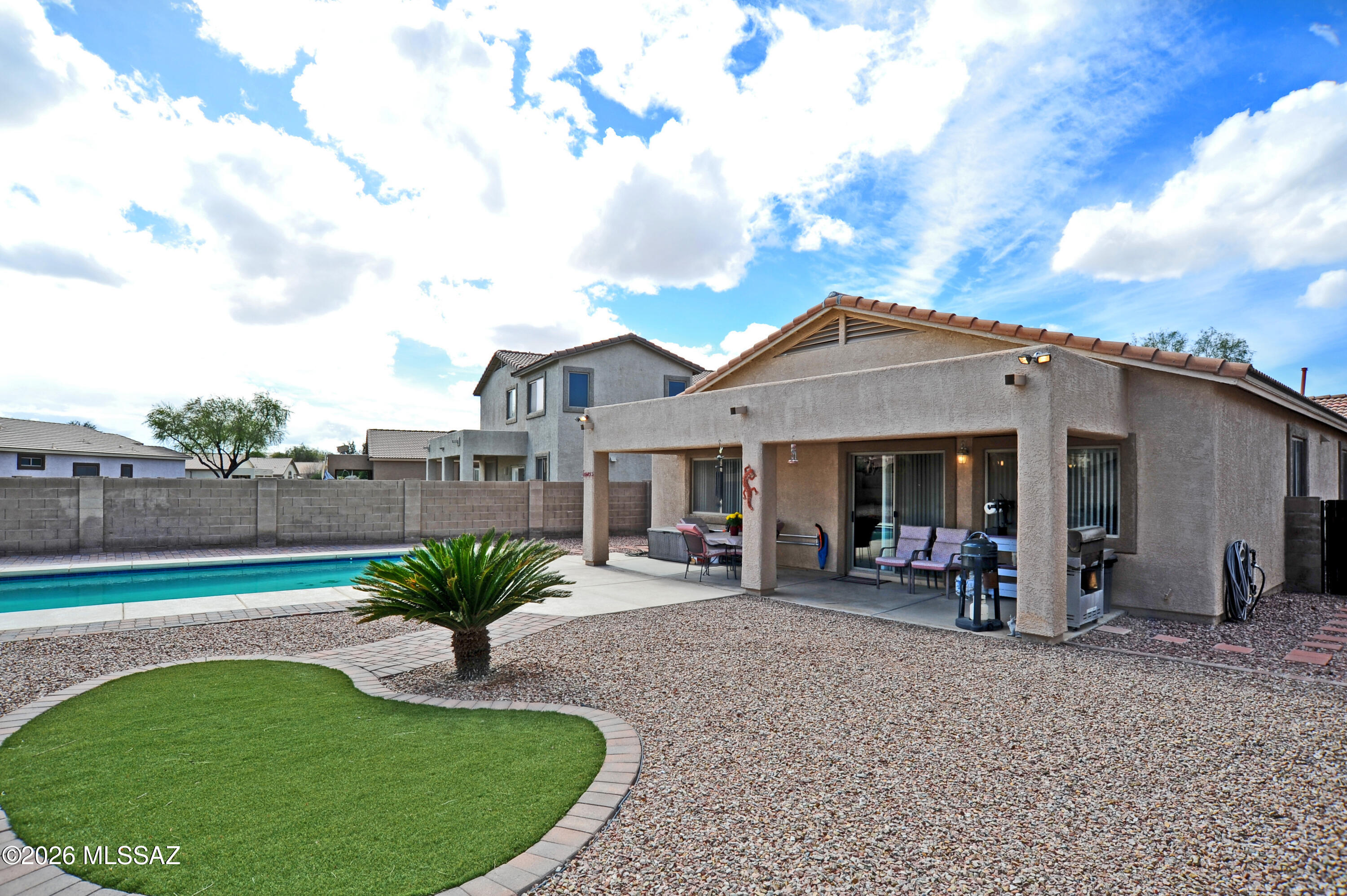 Welcome to your sanctuary in the heart of Marana! This charming single-family home  offers a perfect blend of comfort, style, and community living.
Located in the highly sought-after Gladden Farms community, this  contemporary residence is designed for modern lifestyles. Built in 2006, the home features an open-concept layout that maximizes space and natural light.
Spacious Living: 3 Bedrooms and 2 Bathrooms, including a large primary suite with a walk-in closet.
Features a large pantry, ample cabinet space, and upgraded countertops--perfect for home chefs.
An open great room concept , flowing seamlessly toward the outdoor space. Beautiful large pool. The backyard boasts a covered patio, lush landscaping, and plenty of side-yard space for activities. Living in Gladden Farms means more than just a beautiful home; it's a lifestyle. Residents enjoy:
Access to community parks, lighted basketball and sport courts, and scenic jogging/bike paths.
Proximity to top-rated schools like Gladden Farms Elementary (just 0.2 miles away) and Marana High School.
 A well-maintained neighborhood This property is ideal for those seeking a quiet suburban feel with easy access to I-10, making commutes to Tucson or Phoenix a breeze.