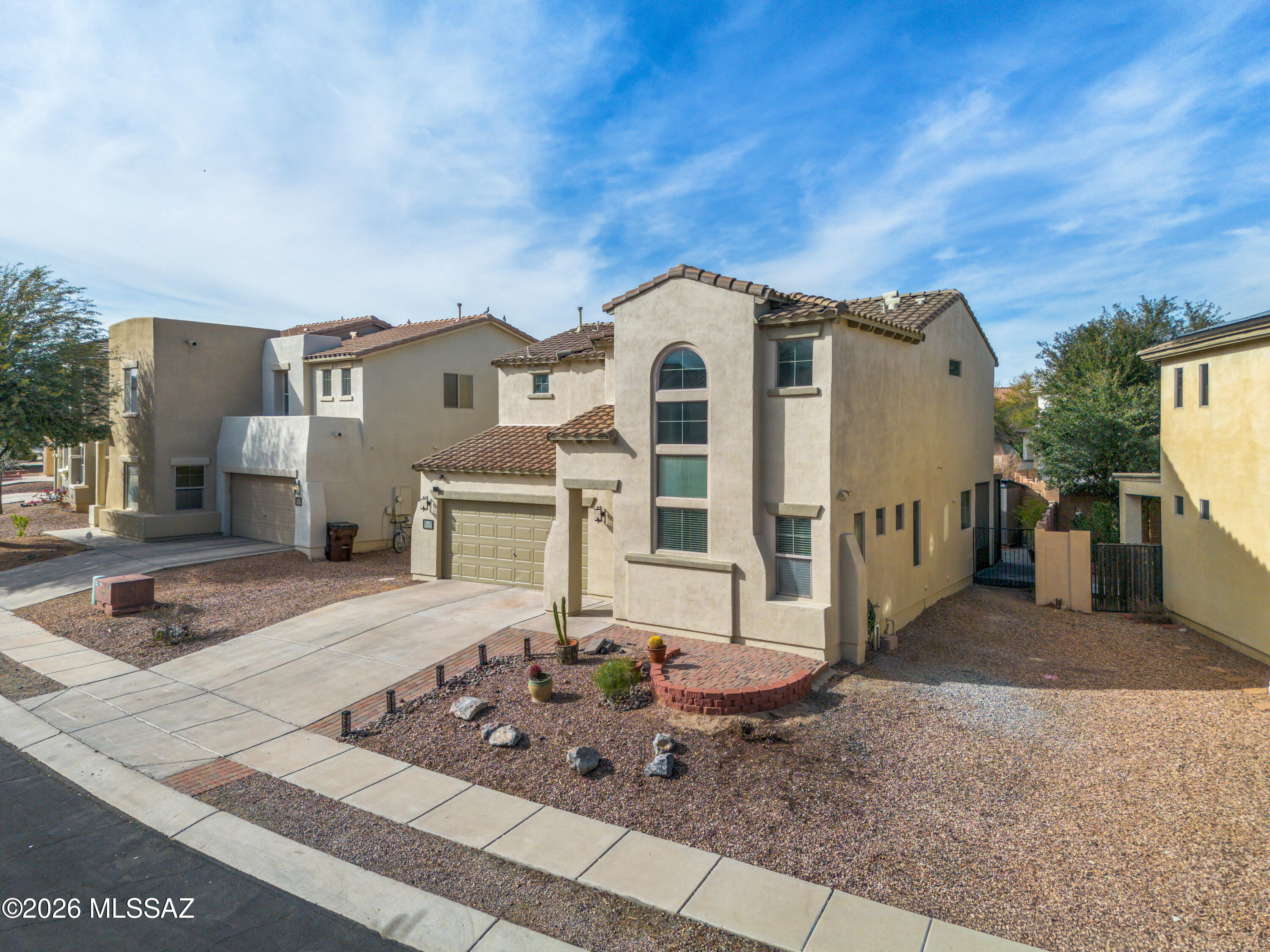 Located in a great central location, this beautifully refreshed two-story home offers 4 bedrooms, including a convenient main-floor bedroom and powder room--perfect for guests, multigenerational living, or a home office.
Step inside to soaring two-story ceilings in the entry and great room, creating a light, open, and inviting atmosphere. The spacious kitchen is designed for both everyday living and entertaining, featuring sleek black stainless appliances, a gas range, abundant counter space, a breakfast bar for casual seating, and a separate dining area ideal for gatherings and family meals.
Upstairs you'll find three additional bedrooms, including the generous primary suite, two full bathrooms, and a dedicated laundry room for added convenience. Enjoy all solid-surface flooring through A hall full bathroom, a conveniently found laundry room, and unique balcony overlooking the great room complete the upper level. Throughout the home, enjoy solid-surface flooring, tile on the main floor and stylish LVP upstairs and in all bedrooms, providing a clean, modern aesthetic with easy maintenance. Fresh interior and exterior paint make this home truly move-in ready.
The backyard is designed for Arizona living with a screened-in patio, an extended paver patio perfect for entertaining, and a storage shed for extra storage and organization.
Located in the wonderful community of Rancho Sahuarita, residents enjoy an active lifestyle with access to scenic walking trails, parks, community pools, a fitness center, clubhouse, splash park, and year-round community events. Whether you love morning lake walks, neighborhood gatherings, or staying active, this community offers something for everyone.
Listed below market value for you to grab today, do not miss this incredible opportunity in Rancho Sahuarita!