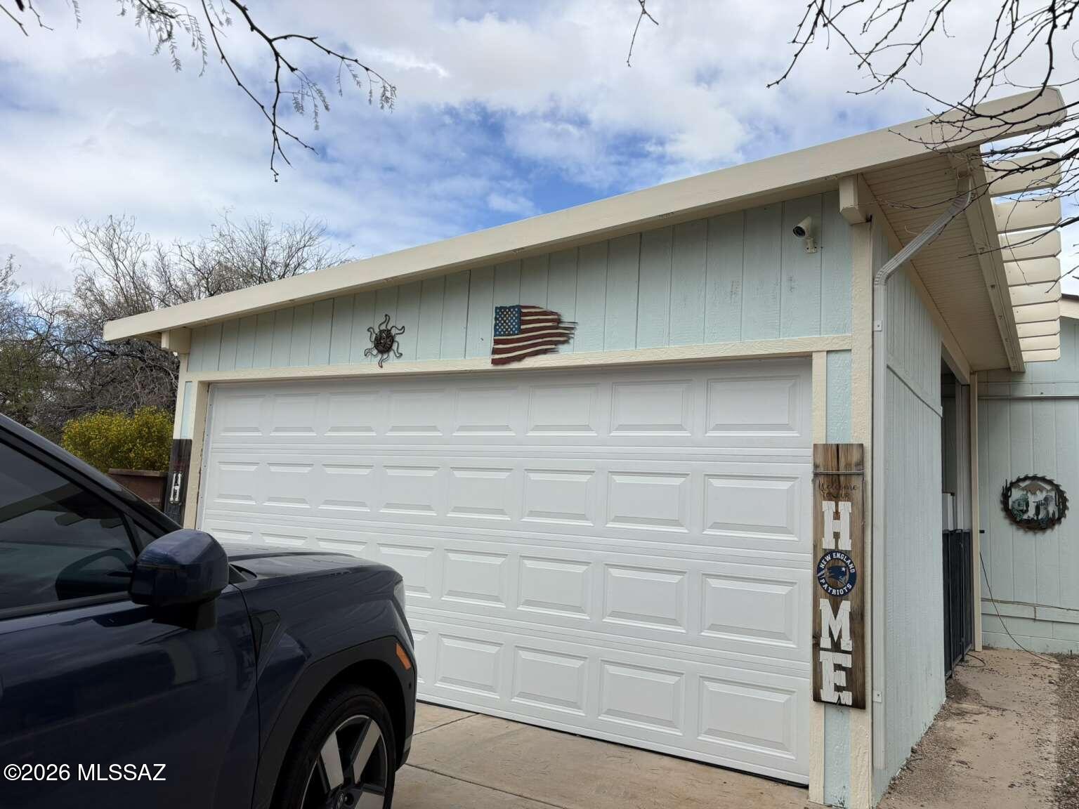 Discover this spacious 4-bedroom manufactured home in a gated Tucson community! Enjoy a contemporary kitchen featuring new cabinets, linoleum flooring, laminate counters, and a brand-new stove. Major upgrades include a 2-year-old roof, solar panels, and a new HVAC system with a 10-year warranty. The home also boasts updated plumbing, a new water heater, a fresh 2-car garage door and newer carpet that is 3 years old. All appliances stay, including two refrigerators and a washer/dryer. with a low $52/mo HOA.