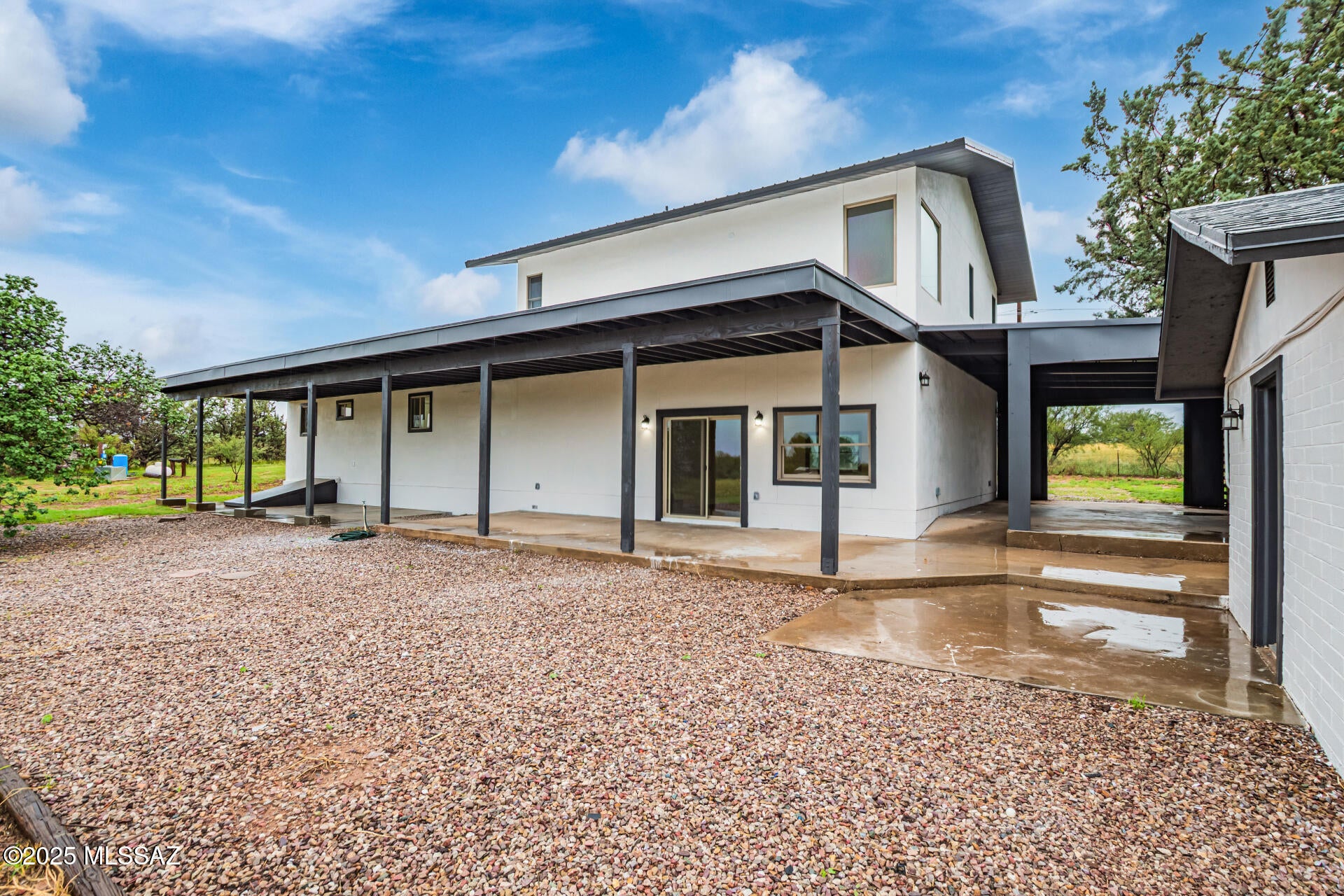 Beautifully updated two-story home on a spacious 2-acre lot with stunning mountain and desert views. Bright, open living areas feature wood-look flooring, a warm neutral palette, and an easy-flowing layout perfect for everyday living or entertaining. The kitchen shines with shaker-style cabinetry, quartz countertops, built-in appliances, and a large center island. The primary suite offers a true retreat with plush carpet, a spacious closet, and a spa-like bath featuring dual sinks plus a separate shower and soaking tub. A versatile loft adds flexible space for a home office, media room, or playroom. Guest quarters include their own kitchen, bathroom, and separate living space, ideal for extended family, guests, or added rental potential. Owner/Agent.