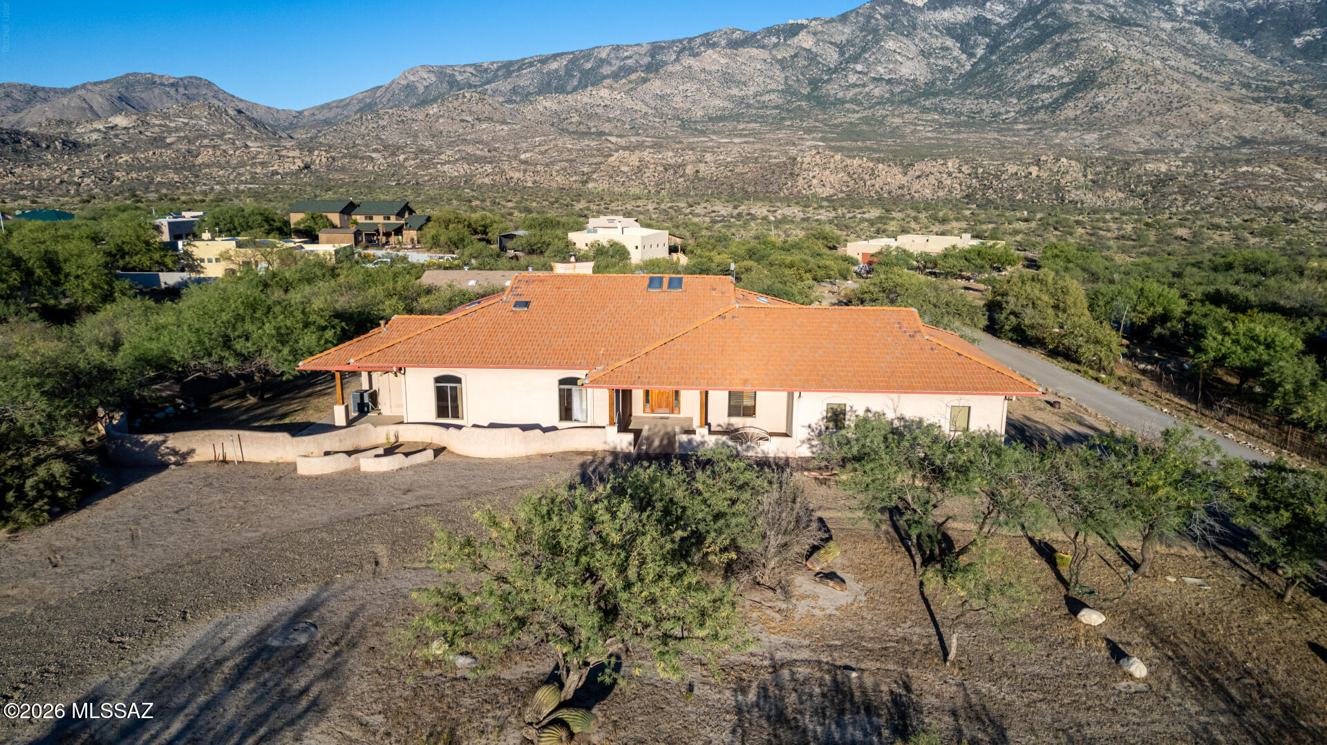 FOREVER VIEWS - RV & HORSE PROPERTY - LARGE WORKSHOP - NO HOA! Come home to stunning desert living with sweeping Catalina Mountain views, along with breathtaking sunrises, sunsets, and even beautiful moonrises that illuminate the surrounding 
landscape in the evening sky.  Enjoy tranquil living in this meticulously maintained custom 4-bedroom, 2.5-bath southwestern ranch stucco frame retreat, nestled on a flat 1.043-acre lot in the peaceful town of Catalina. 

Just 5 minutes from town and the world-renowned Miraval Resort, this 2,144 sq ft home offers the perfect blend of comfort, functionality, natural lighting and beauty--with no HOA restrictions. Recent upgrades include a brand-new tile roof with a 30-year transferable warranty, a new refrigerator, and a new washer and dryer. The home also features a newly installed leach field, adding peace of mind and long-term value. Inside, the functional-style kitchen is beautifully appointed with granite countertops and a layout ideal for both everyday living and entertaining. Each bedroom offers its own private patio, creating seamless indoor-outdoor living and personal spaces to relax and take in the serene desert surroundings.

The property includes an over-extended 2-car garage, an RV carport, and a former horse setup, offering the potential to easily re-establish equestrian facilities if desired. Additionally, there is a large versatile 660 sq ft workshop equipped with electric and water, complete with its own dedicated carport and private patio, and can easily be converted into a casita, tack room, barn, or flexible-use space to suit a variety of needs.

Surrounded by natural beauty, this location is a paradise for outdoor enthusiasts--offering endless opportunities for horseback riding, hiking, and mountain biking. You're just minutes from Coronado National Forest, home to the popular 50-Year Bike Trail, one of Southern Arizona's most scenic and beloved multi-use trail systems.

This is more than a home--it's a lifestyle rooted in freedom, nature, and breathtaking desert serenity.