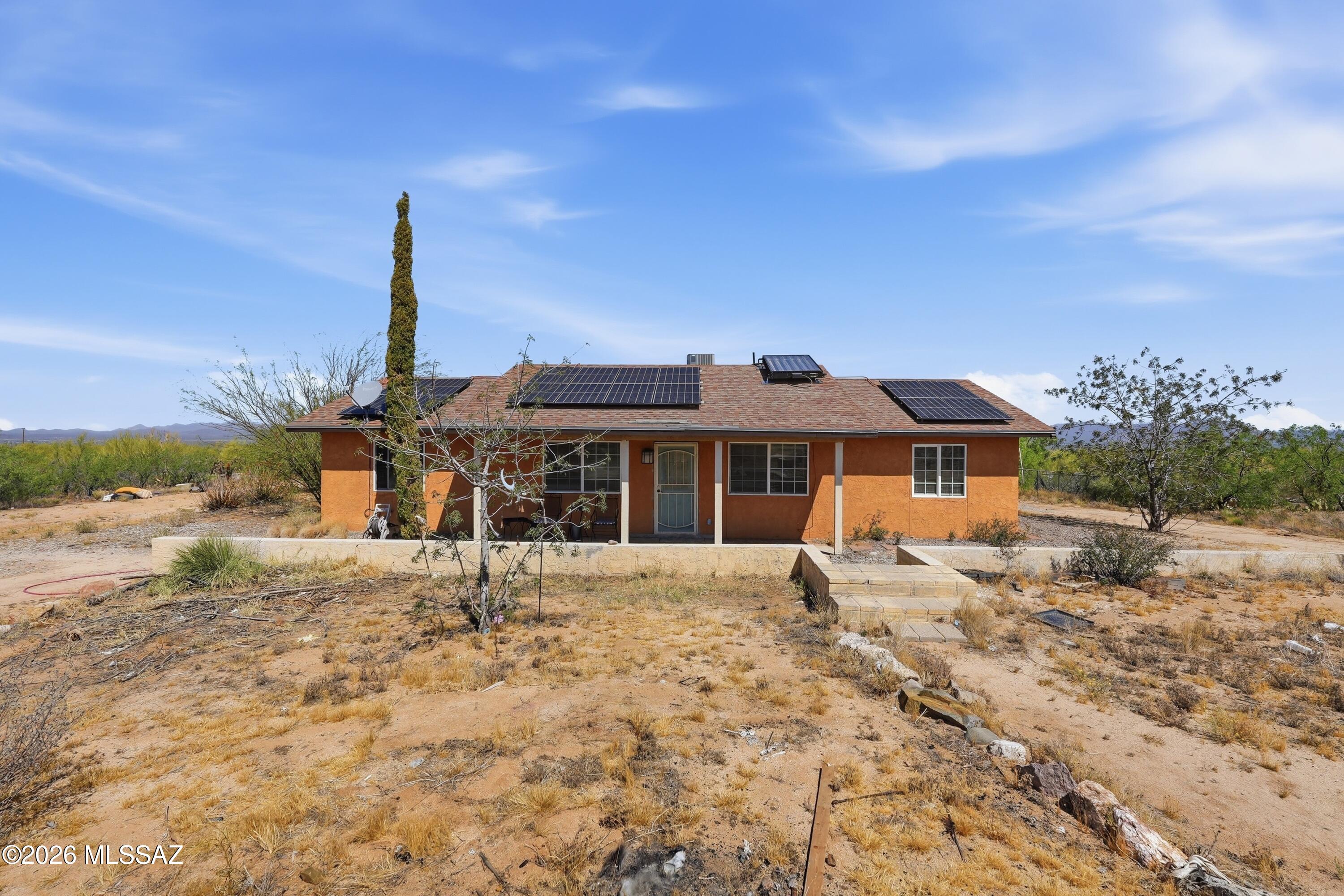 This unique 3 bedroom, 3 bathroom home offers 1,680 sq ft of living space set on an expansive 2.45-acre lot - perfect for those seeking space, freedom, and opportunity. With no HOA, you'll have plenty of room for your RV, desert toys, boats, or even to create your own horse property, garden, or mini ranch. The property is surrounded by beautiful natural desert landscape, offering privacy and wide-open views. Inside, the home features an open floor plan with a split-bedroom layout, complemented by tile and carpet flooring with neutral tones throughout. Enjoy an enclosed covered patio and a crisp, clean pool, perfect for relaxing and entertaining. Ideally located just a few miles from Ajo, near Peak National Observatory, and within reach of Puerto Peñasco, while still about 30 minutes from Tucson - this property offers both seclusion and accessibility. A rare opportunity to own acreage with incredible flexibility - bring your vision to life!