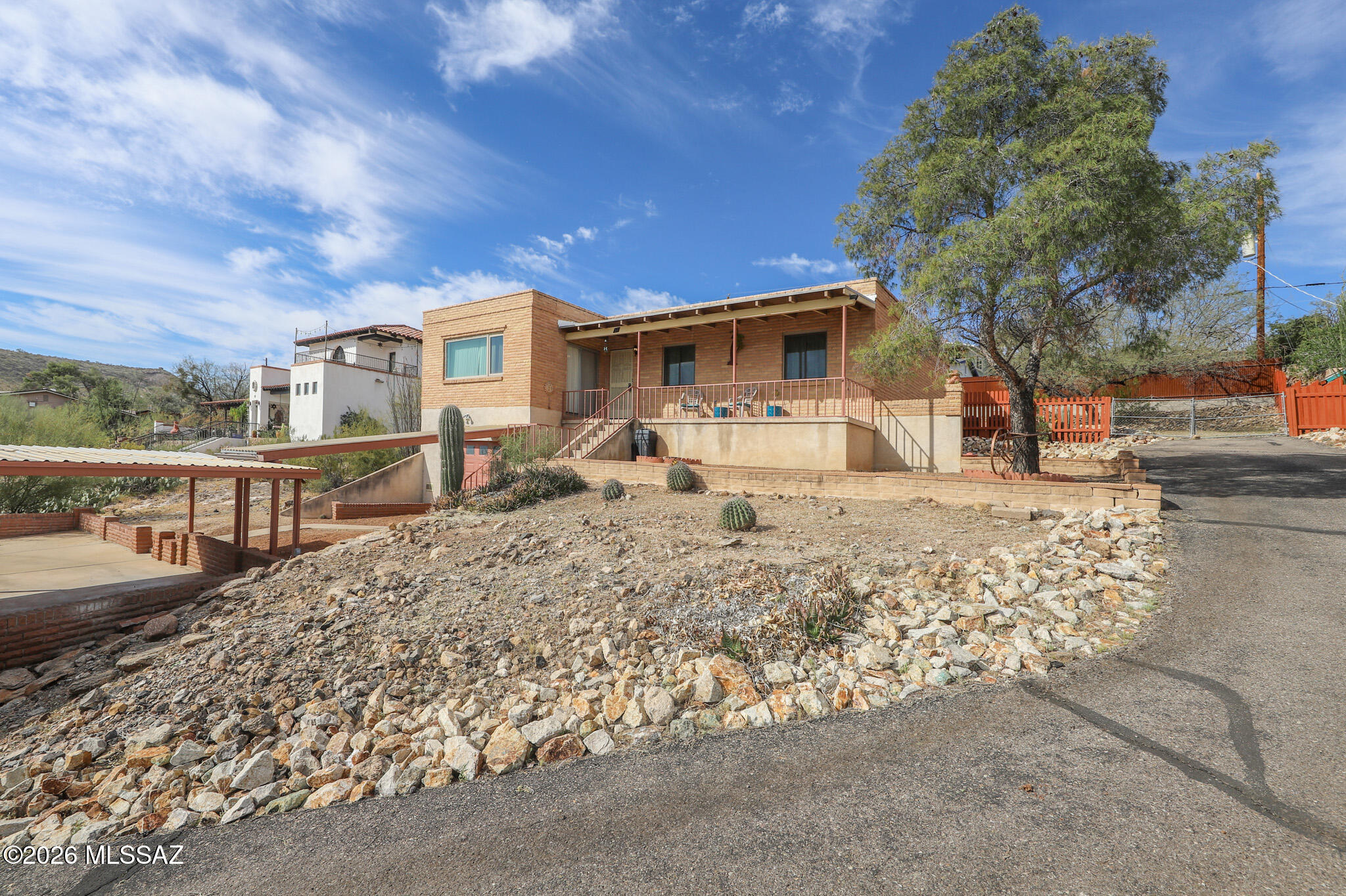 Beautifully maintained, single-owner home in one of Tucson's most unique neighborhoods. Nestled just west of downtown near Tumamoc Hill and A-Mountain, this property offers incredible city and mountain views. Upgraded kitchen and flooring add modern style, while major updates provide peace of mind: A/C and heat pump replaced two years ago, plus a Perma-Lined sewer line. Energy-efficient windows by Andersen Corporation. Close to dining, entertainment, St. Mary's Hospital, and Pima Community College. Don't miss this opportunity!
