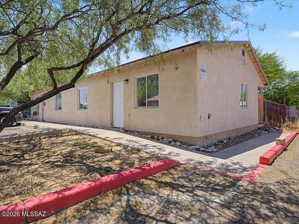 Fully leased income property in central Tucson! Built in 2005, this detached duplex offers two single-story units, each with 2 bedrooms, 1 bath and approx. 762 sq ft. Both units are currently occupied, bringing in $2,050/month in rent. Both units have new hot water heaters and unit 2 has a new AC unit.  Tenants pay electric, gas, water/sewer, trash and cable, keeping owner expenses low. Frame-stucco construction, shingle roof, central A/C with ceiling fans and easy-care ceramic tile floors. Kitchens include a gas range, refrigerator and dishwasher, plus Energy Star appliances. Low-maintenance desert landscaping front and back with on-site parking. Conveniently located just off N Stone Ave near shopping, dining and transit. A great addition to any investment portfolio or a smart first step for a new investor!