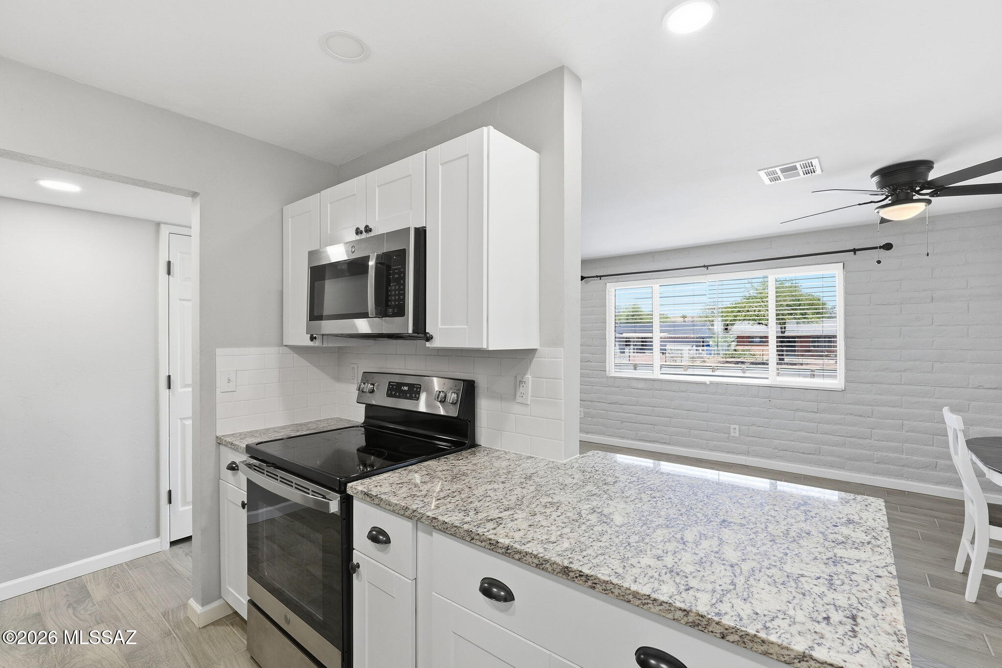 Existing VA mortgage at 5.125% may be assumable. Beautifully updated, move-in ready 4 bedroom 2 bath home with 1,379 sq ft. Featuring a newer roof, newer A/C and a beautifully updated interior with spacious living space. The kitchen shines with granite countertops, white cabinetry, subway tile backsplash, and stainless steel appliances. The oversized 4th bedroom offers vaulted ceilings and flexible space for guests, office, or hobbies. Enjoy a large backyard with paver patio, artificial turf and plenty of room to create the outdoor setup you've been dreaming of.