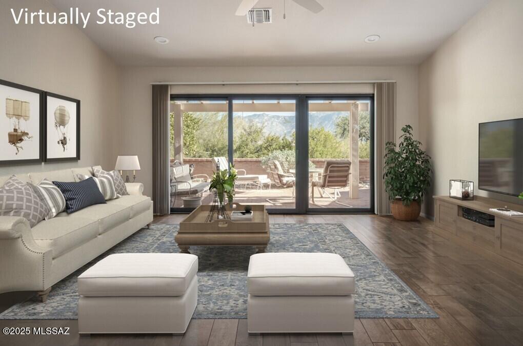 Over $100,000 in upgrades elevate this stunning 1,185sf 2BR/2BA townhome with all furnishings included, in the sought-after Sun City Oro Valley age-restricted community. Every inch has been transformed for comfort, efficiency & modern desert living allowing you to move in and simply enjoy the lifestyle you deserve. With Exquisite Updates & Quality Finishes you'll find porcelain tile flooring throughout, custom cabinetry & quartz countertops in the kitchen & baths. Reimagined kitchen includes a relocated refrigerator for improved flow, new sink,  custom pantry & linen storage. Both bathrooms have been fully remodeled, including the primary bath's double-sink vanity, redesigned shower, new mirrors, lighting & comfort-height toilets. Primary suite features California Closets custom system w/pull-out drawers, hampers & shelving, while the second bedroom doubles as a flex space with a walk-in closet, wall bed & custom built-ins. Enjoy Energy Efficiency w/major system updates, including newer HVAC (2022), added attic insulation & vent fan, newer tile roof (2005) & flat roof coating (2023). Pella windows fill the living & dining areas with light w/window films & shade screens, The east-facing backyard offers mountain views, an Alumawood ramada, fully fenced yard, & patio furniture with BBQ included. Garage adds functionality w/workbench, cabinets & shelving. Set next to a beautifully maintained Sun City common area, you'll enjoy privacy, wildlife views & festive holiday decor from across the street. The Green Tree HOA covers roof, exterior paint & front yard maintenance, giving you a true lock-and-leave lifestyle. It's the only street in Sun City Oro Valley with streetlights that have been recently replaced with LED for improved ambiance & safety. Resort-Style Amenities are just moments from your door. Enjoy the best of Sun City Oro Valley where beautiful weather, breathtaking Catalina Mountain views & a wealth of amenities make every day extraordinary. Begin your morning at the on-site restaurant, then explore your passions: play a round on the championship golf course, stay active in the aquatic & fitness center, enjoy tennis or pickleball, or express creativity in the artisan center. Hike nearby desert trails or simply relax & soak in the scenery. This home stands apart with its extensive upgrades, superior location & effortless lifestyle.