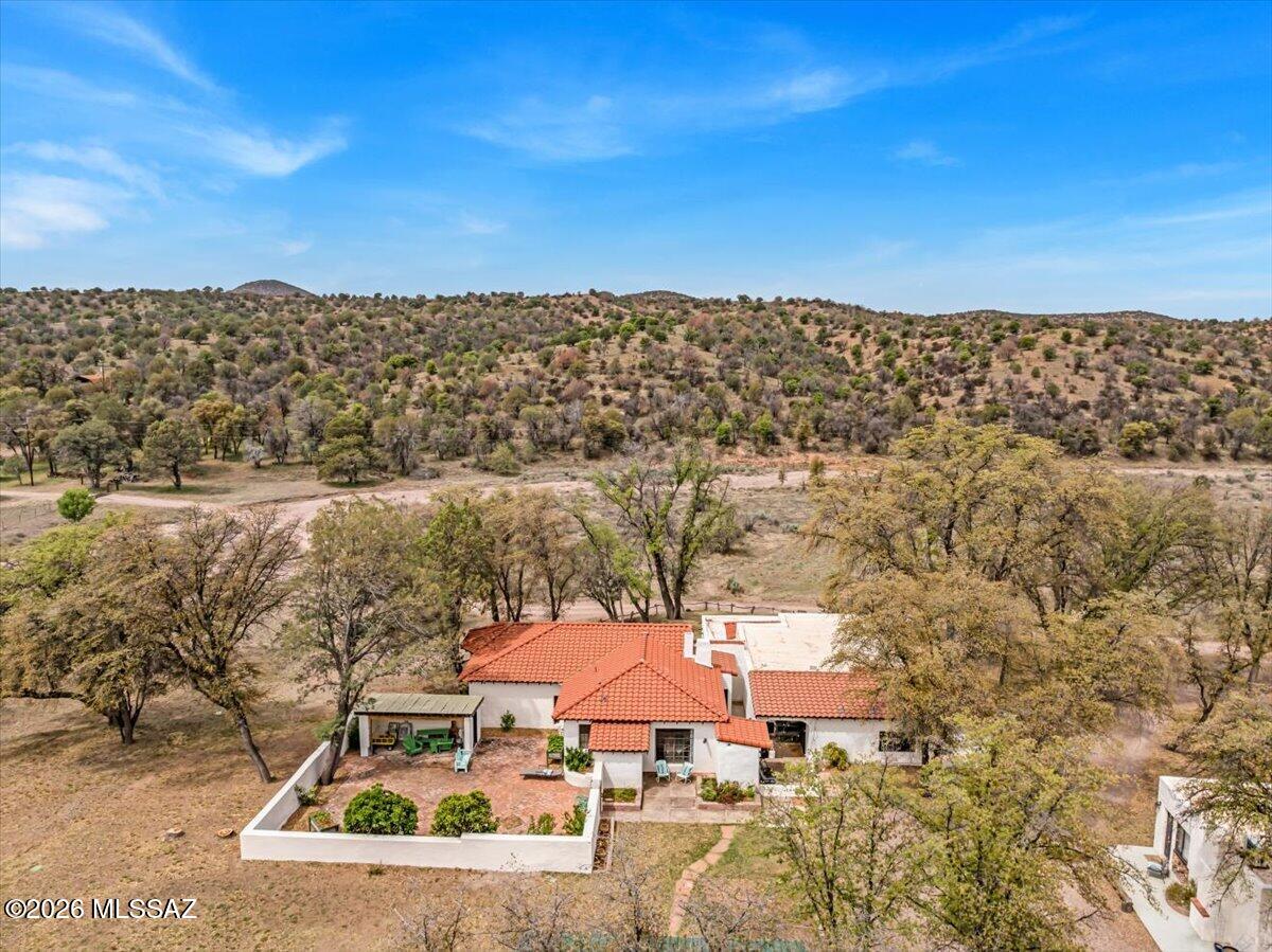 Classic Arizona Ranch, Discover a sanctuary in the Oak Forest where the raw power of nature meets human history. This historic ranch isn't just a property; it's a vortex of beauty that demands to be experienced. The estate boasts seven updated units, anchored by a stunning 2,600 sq. ft. adobe manor. From the site-sourced oak vigas to the original hand-hewn hardware and hardwood finishes, every inch feels like an authentic time capsule. This home is a labyrinth of cozy fireplaces and enchanting crannies that evoke a vibe long forgotten.
Outside, 80 acres of pristine land are bordered on two sides by State Land, creating an infinite backyard accessible through your own private gates. The property is fully equipped for world-class equestrian use with a new tack room and stallion arena