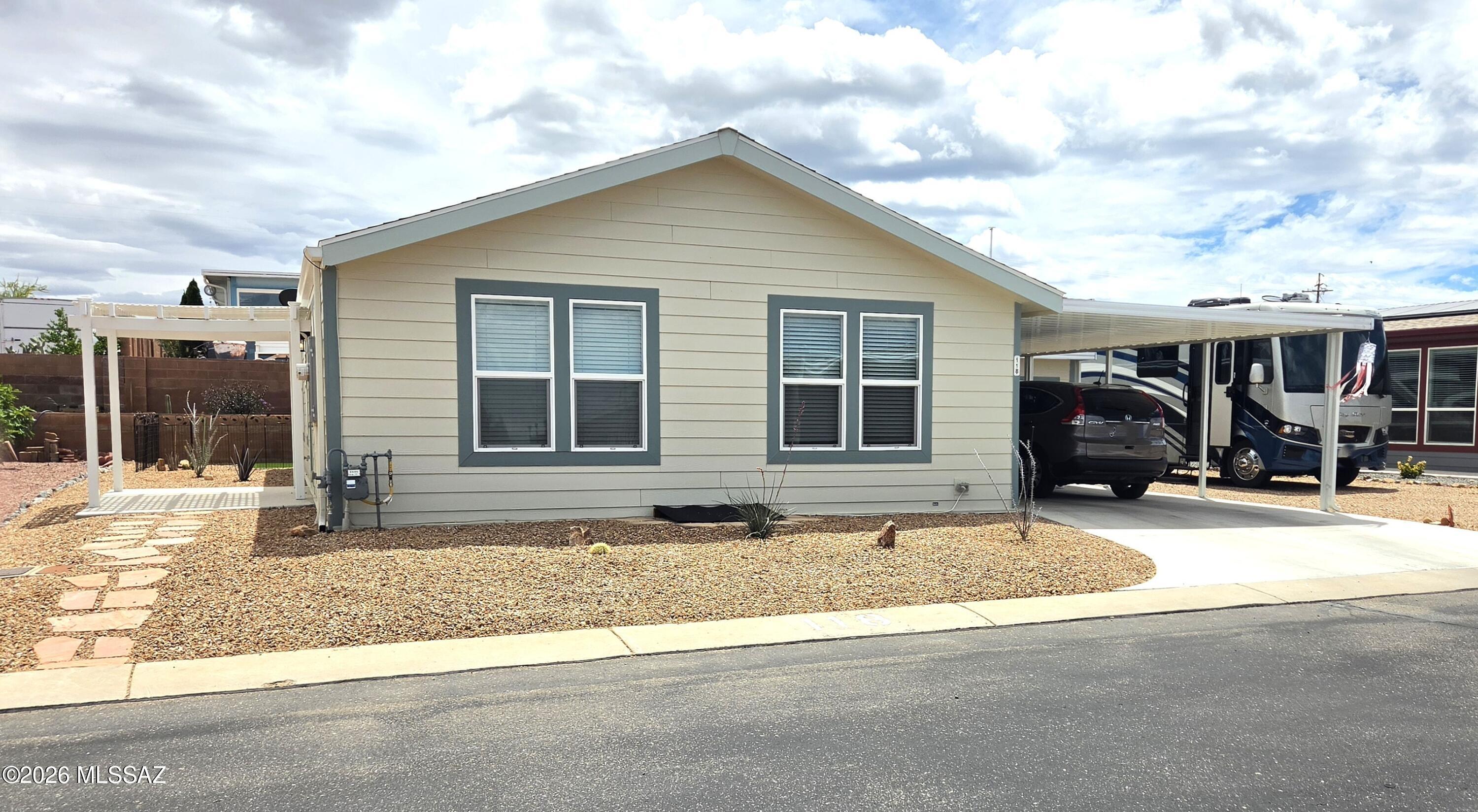 This 2023 Cavco is just the right size for someone looking to downsize. In addition to the well maintained interior, you'll see in the photos, you have a two car carport to protect your vehicle from the AZ sun. 
The shed is completely finshed with water, electric, mini split and drywalled. Want to give your puppies a bath, there's even a deep sink for that. 
The side yard will accomadate parking a travel trailer or class A motor home and the rear yard can be fenced for the little four legged friends. 
If you don't like a lot of housework this is the one you've been waiting for.