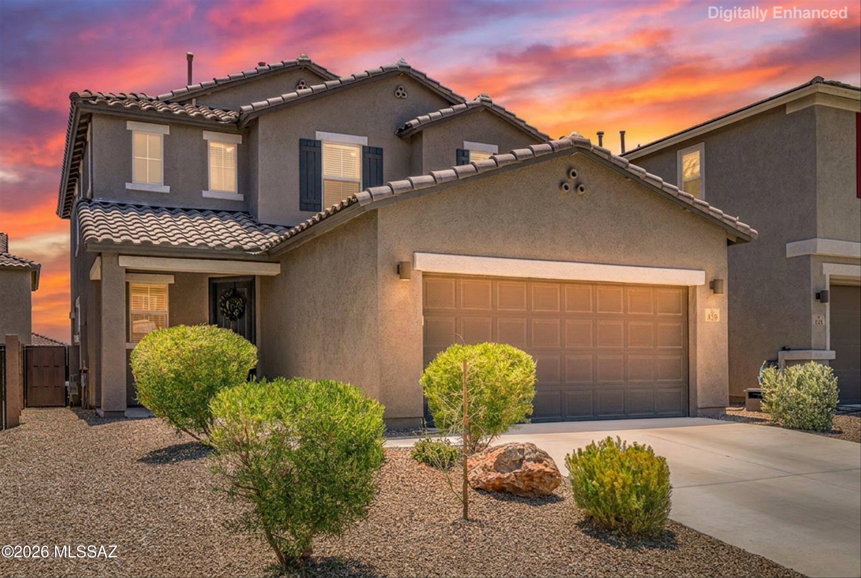 Welcome to this remarkable home in Entrada Del Pueblo, one of Rancho Sahuarita's newest and most desirable neighborhoods. Ideally located near the community's newest amenities, you'll enjoy easy access to open green space, the second community dog park, cornhole area, chess tables, multiple playgrounds, the community lake, fitness center, restaurants, shopping, and the highly anticipated new clubhouse area.
From the moment you arrive, the curb appeal and welcoming presence set the tone for what awaits inside. Thoughtfully designed and impeccably maintained, this home offers an elevated living experience with upgraded paint, designer finishes, refined details, and a beautifully enhanced stair railing that adds both character and sophistication. Every space has been carefully curated to create a warm, inviting atmosphere that feels both stylish and comfortable.
The main level features a bright and open floorplan centered around a striking electric fireplace and custom feature wall that create an impressive focal point for everyday living and entertaining. The glass-door office provides excellent flexibility and can easily function as a fourth bedroom, with space already available for a future closet addition.
The kitchen blends beauty and functionality with rich espresso cabinetry, brushed gold hardware, a designer backsplash, black sink, ample storage, and an open layout that flows seamlessly into the living and dining spaces.

Upstairs, a spacious loft offers additional living space perfect for a media room, play area, home gym, or second family room. Three generously sized bedrooms, a conveniently located laundry room, and additional storage complete the upper level.

One of the home's most valuable features is the professionally landscaped backyard, offering a move-in ready outdoor retreat while saving thousands in landscaping expenses. Designed for both relaxation and enjoyment, the outdoor space provides the perfect setting for entertaining, unwinding, and embracing Arizona living.
Combining thoughtful design, modern upgrades, exceptional community amenities, and a location that continues to grow in popularity, this home delivers the perfect balance of style, comfort, and value. Beautifully finished and truly move-in ready, this is a home that feels elevated, welcoming, and ready for its next chapter.