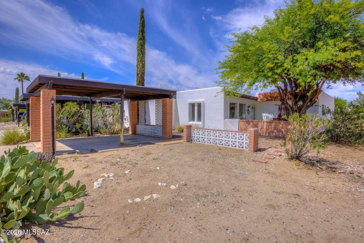Welcome to this well-maintained 2-bed, 2-ba end unit located at Casa Paloma II. This home offers privacy, comfort, and thoughtful upgrades. Enjoy tile flooring throughout, a bright and versatile Arizona room, the convenience of an in-unit, washer and dryer, newer refrigerator conveys, making this home truly move-in ready. The property has a private front gated yard as well as a rear gated yard accessible directly from the Arizona room, providing ideal outdoor space for relaxing, gardening, or entertaining. Major mechanical peace of mind comes with a newer air conditioning system installed in 2024, ensuring efficient cooling during Arizona's warm months. Seller financing available!