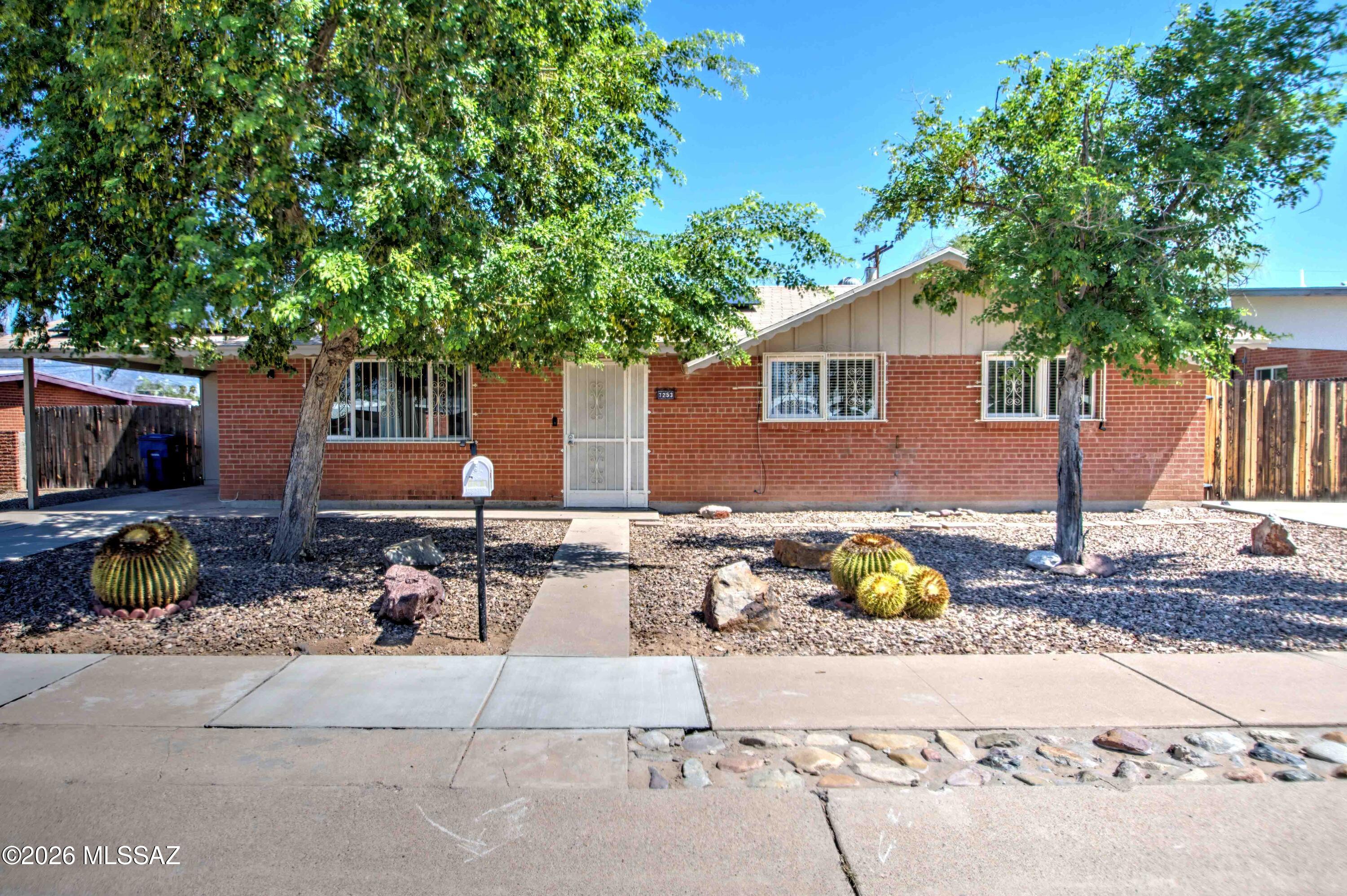Wonderful brick home in the desirable neighborhood of Longview Estates.   Close to any amenity you can image!  Very spacious with two large living areas on either side of the kitchen. 4 nice sized bedrooms with lots of natural light.  Entertain or relax outdoors with the generous covered patio, some Catalina Mountain views and sparkling pool.  A very large part of the yard allows for toys or pets and is separated from the pool area.  Owned Solar.