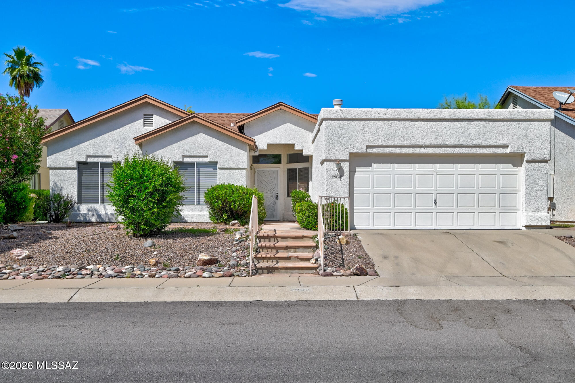 Agent/owner related. Welcome to a beautifully maintained 3BD/2BA home in desirable Northwest Tucson offering 1,624 sqft of comfortable living space. Inside, you'll find soaring vaulted ceilings, abundant natural light, an open-concept layout, tile flooring, and a cozy double sided fireplace. The kitchen features warm wood cabinetry and ample counter space. The spacious primary suite includes backyard access, a walk-in closet, soaking tub, and separate shower. Enjoy the covered patio, low-maintenance landscaping, and freshly coated garage floor with utility sink and storage. Recent updates include a new shingle roof and flat roof recoating (2 yrs), exterior repaint and fascia sealing (2 yrs), new roof-mounted gas-pack A/C (1 yr), fresh interior paint, and new bedroom carpet (3 mos).
