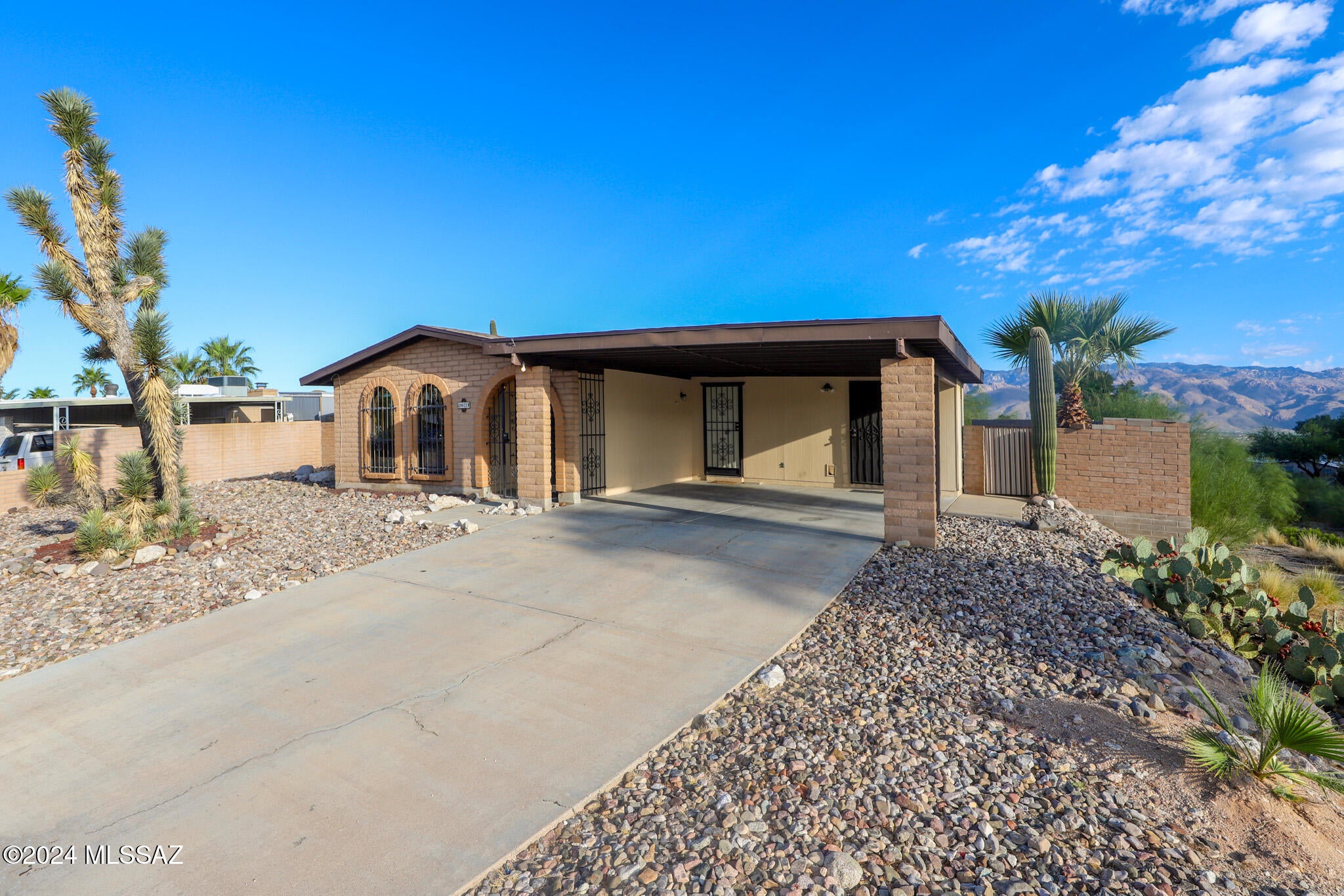 This beautiful 4-bedroom, 2-bath home on the east side offers stunning mountain views and plenty of living space. The home features a bright living room, a cozy family room, and a formal dining area, perfect for hosting gatherings. The kitchen provides ample counter space, plenty of cabinets, and a pantry closet for extra storage. Both bathrooms have been updated for modern comfort. Additional highlights include a separate storage closet off the carport, a covered back patio, and a sparkling poolÂ—ideal for relaxing and enjoying the outdoors. Don't miss out on this fantastic home in a desirable location with amazing mountain views!!!