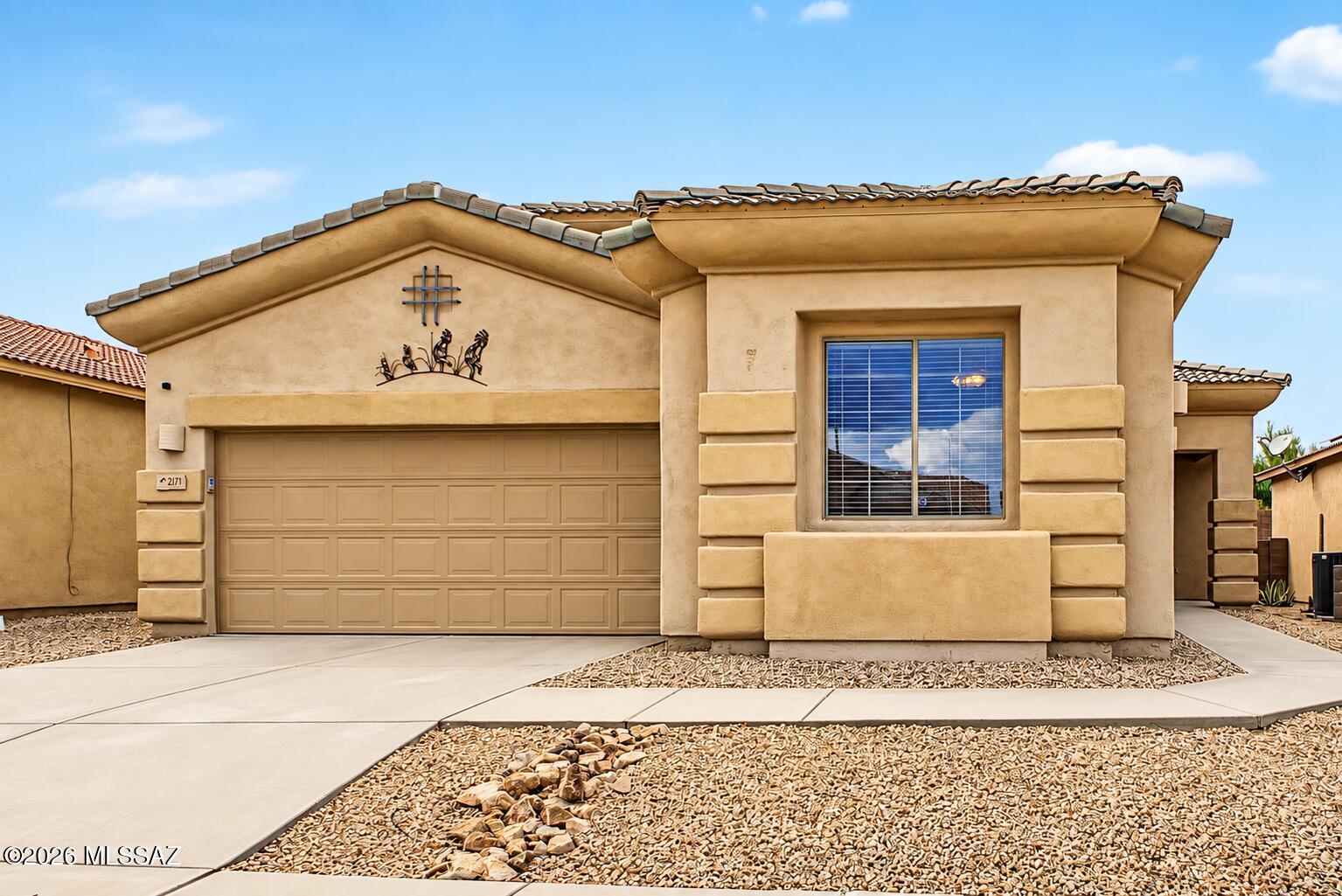 Bright, spacious, and move-in ready! This inviting 3-bedroom, 2-bath home in the desirable La Joya Verde 55+ community features a brand new HVAC system, split-bedroom floor plan, vaulted ceilings, abundant natural light, fresh interior paint, and a cozy gas fireplace. The kitchen offers ample cabinetry, a pantry, breakfast bar, and breakfast nook, while a versatile bonus room/den provides additional space for a home office, hobby room, or guest space. The spacious primary suite features a walk-in closet and private bath with a soaking tub. Enjoy a low-maintenance backyard with a mature citrus tree, 2-car garage, and no mandatory Green Valley Recreation membership. Conveniently located near shopping, dining, and everyday amenities
