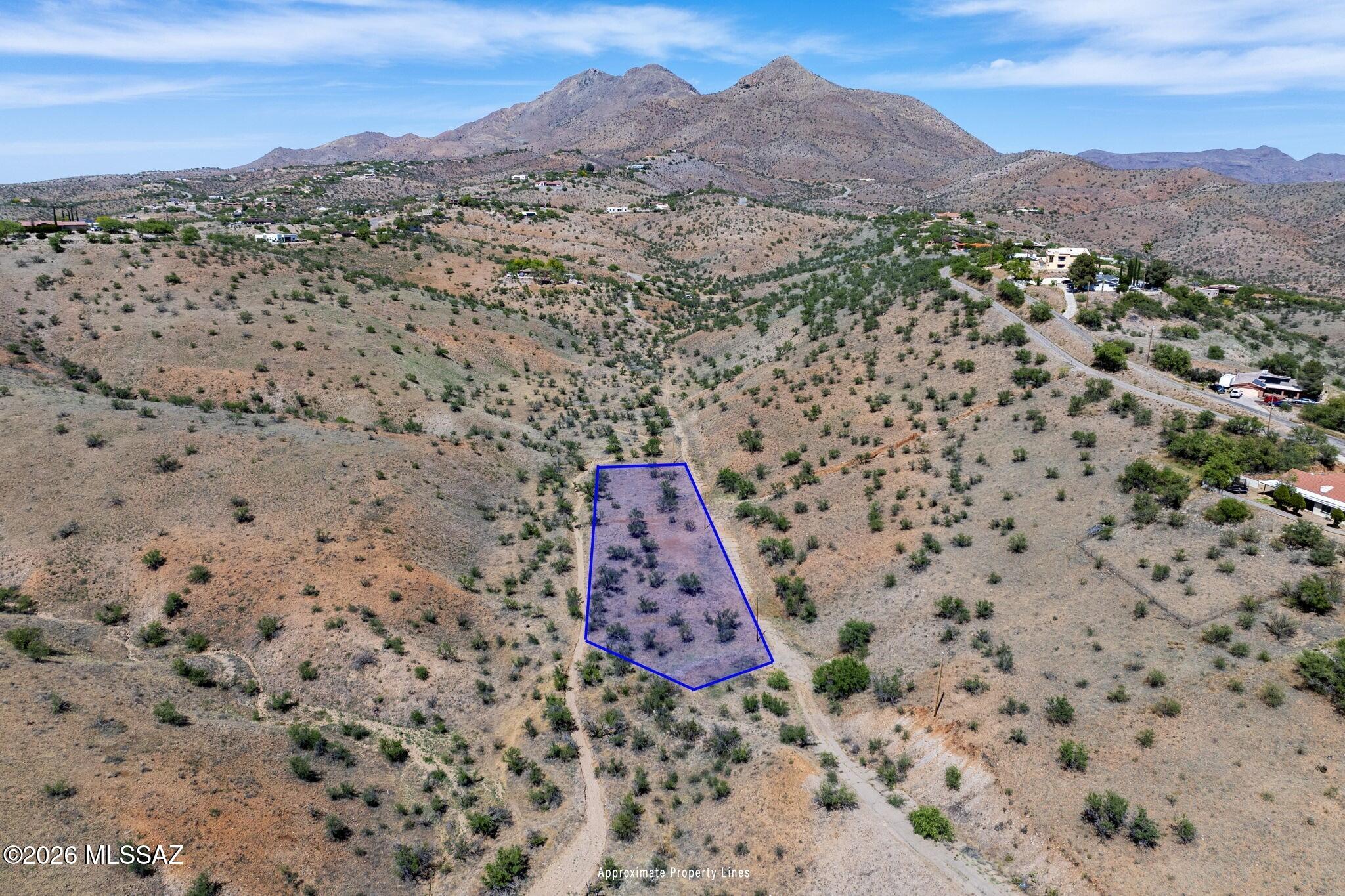 Discover the potential of this spacious 0.88-acre lot located in the desirable Rio Rico Ranchettes subdivision. Situated at 1260 Tocar Ct on a quiet cul-de-sac, this property offers added privacy and a peaceful setting surrounded by Southern Arizona's natural beauty. Enjoy scenic mountain views, open skies, and plenty of room to design and build your custom home. With convenient access to nearby utilities, shopping, dining, and outdoor recreation, this parcel is ideal for both future development or investment. Take advantage of this opportunity in a growing community.