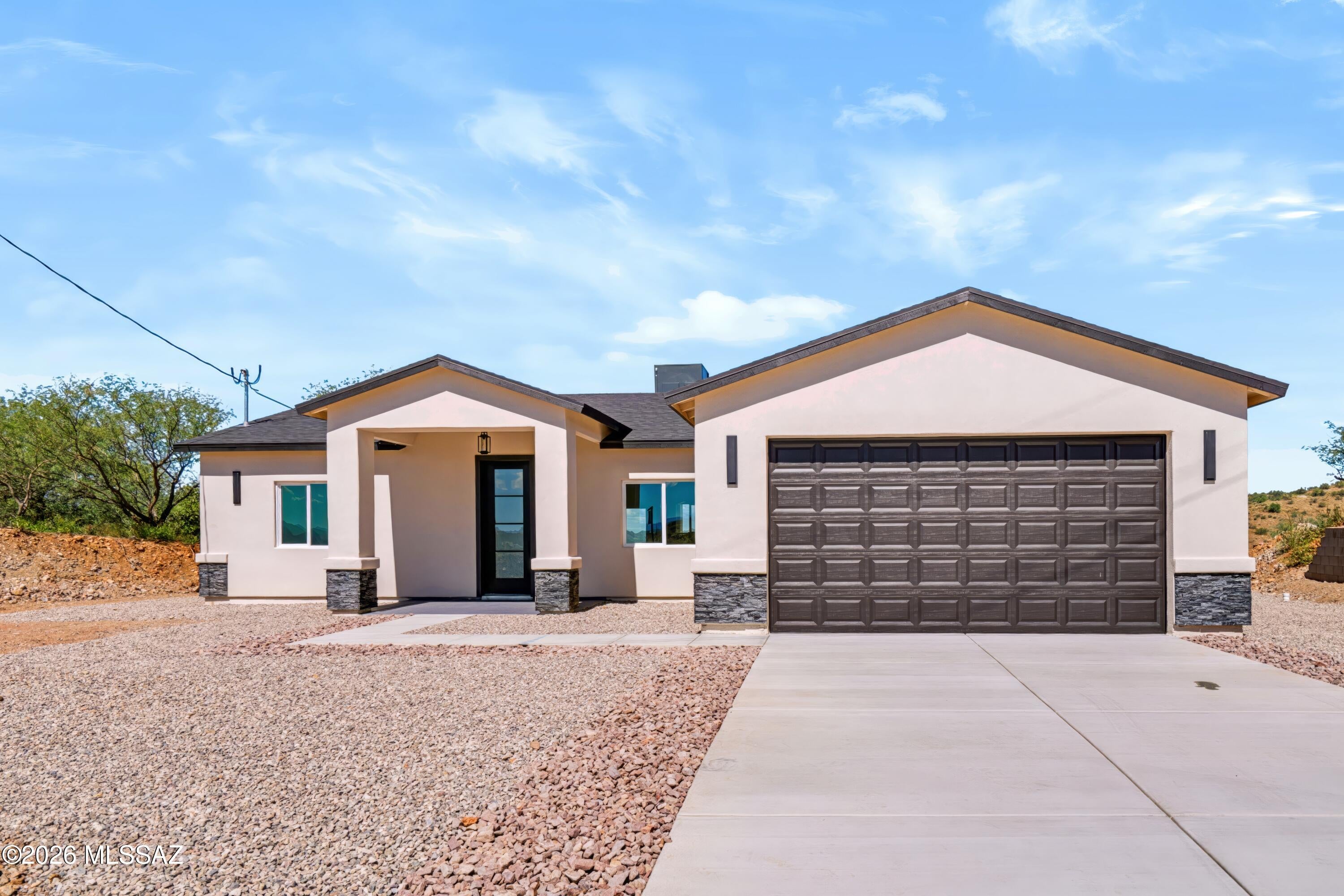 Welcome to this beautifully situated 3-bedroom, 2-bath home offering 1,565 square feet of comfortable living space on a generous half-acre lot. Enjoy breathtaking mountain views right from your backyard, creating a serene and scenic backdrop for everyday living. Inside, the home features durable ceramic tile flooring throughout and stylish quartz countertops that bring a modern touch to the kitchen and living spaces. The layout offers both functionality and comfort, ideal for families or those who love to entertain.