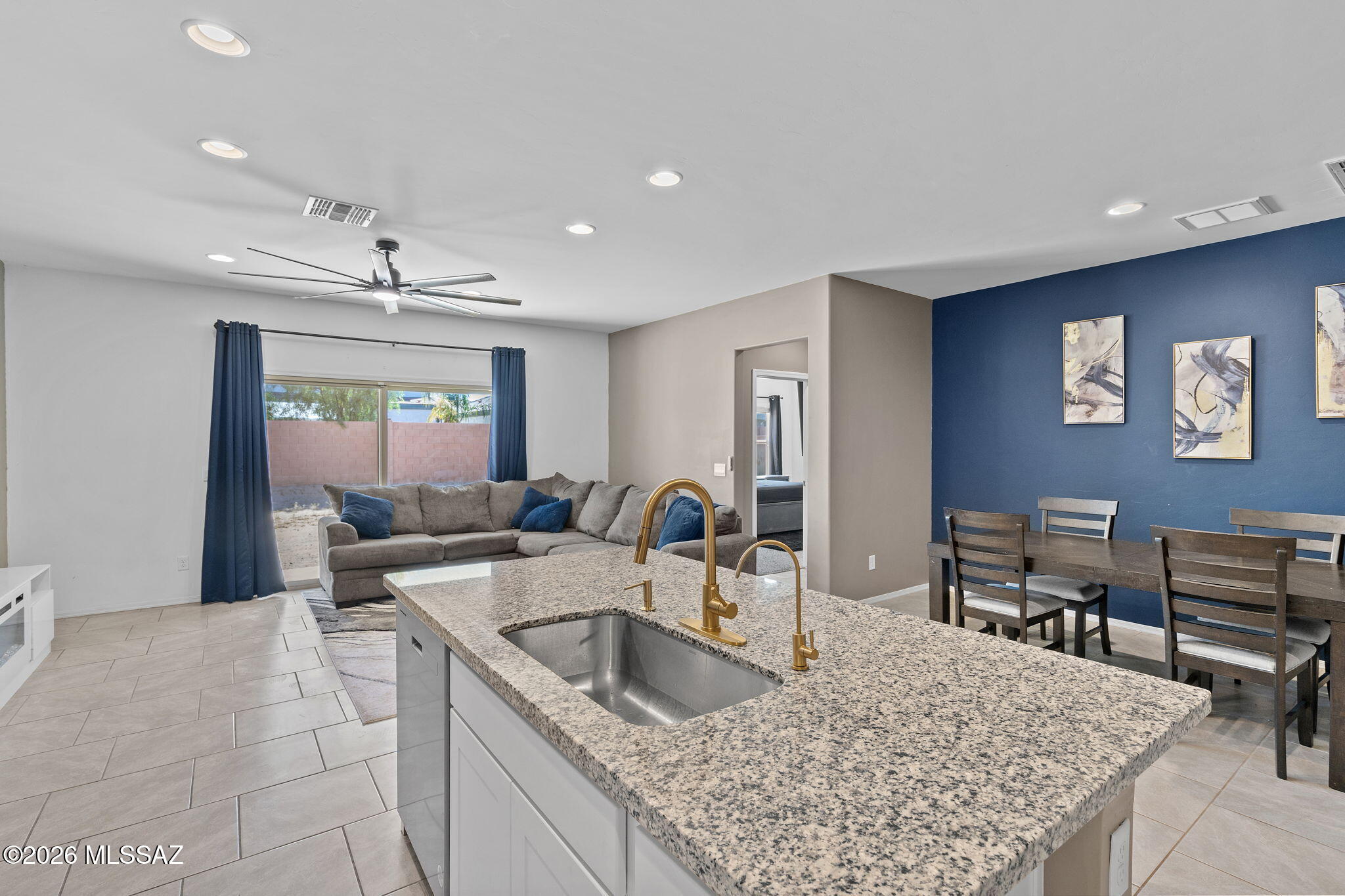 Assumable loan and better than new! This move-in ready Easton Plan home at Barnett Village boasts fresh interior paint, new stylish kitchen fixtures, granite countertops throughout, and ceiling fans in every room, this home has been thoughtfully updated and ready for its next owner. The spacious primary suite features a large walk-in closet and double vanities in the bath. The open Great Room flows seamlessly into the dining area with a kitchen showcasing 36'' shaker cabinets, Bengal white granite, and 18x18 Cabris tile. Modern comforts include the DuPure® Ultra Filter water system, Rinnai® tankless water heater, and Smart Home features. Enjoy 9-foot ceilings, community walking paths, a tot lot, BBQ area, and breathtaking views, right in the heart of Marana!
