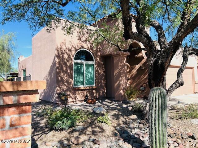 Rare opportunity in Sierra Catalina Estates! Charming single story standalone home in a highly sought-after foothills community where homes rarely come available. Lovingly maintained by the original owner, this immaculately cared-for Southwestern gem features tile floors, soaring ceilings & a beehive wood-burning fireplace. Updated kitchen w/ stainless steel appliances & induction stove, plus a remodeled primary bath w/ custom walk-in shower. New windows throughout add comfort & efficiency. French doors open to a spacious patio w/ stunning sunset & mountain views & exceptional privacy-no neighbors behind or to the south. Gated community, walking distance to Orange Grove Middle School & La Encnatada's premier outdoor shopping center, owned solar panels & thoughtful upgrades throughout!