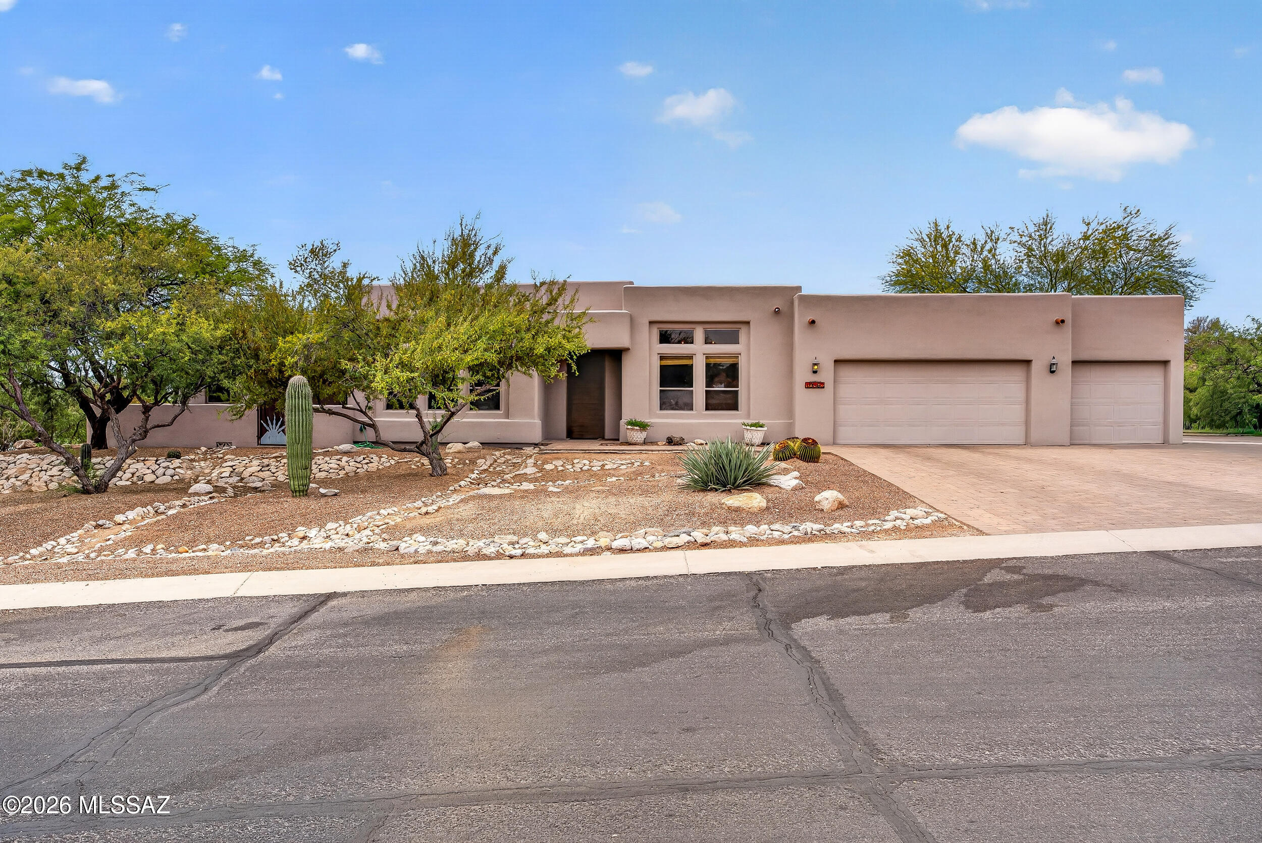 Beautifully remodeled home located in a gated  community in desirable east side location. Enter through the custom 8' front door to a bright and spacious split bedroom floor plan with high 10.5' ceilings and lots of natural light. Gorgeous kitchen with large island, high-end oversized 6-Burner 36'' range, custom hood, pot filler, quartz counter tops, walk in pantry, and stainless appliances. Huge primary suite with fire place, double vanity, walk in closet and beautiful shower. Eye catching tile throughout with carpet in the bedrooms and all new interior doors. Huge 1 acre corner lot with oversized (31'x28') 3 car garage, large rear covered patio over looking sparkling pool with motorized cover (updated pool equipment in 2024) and gorgeous sunset views. Must see!