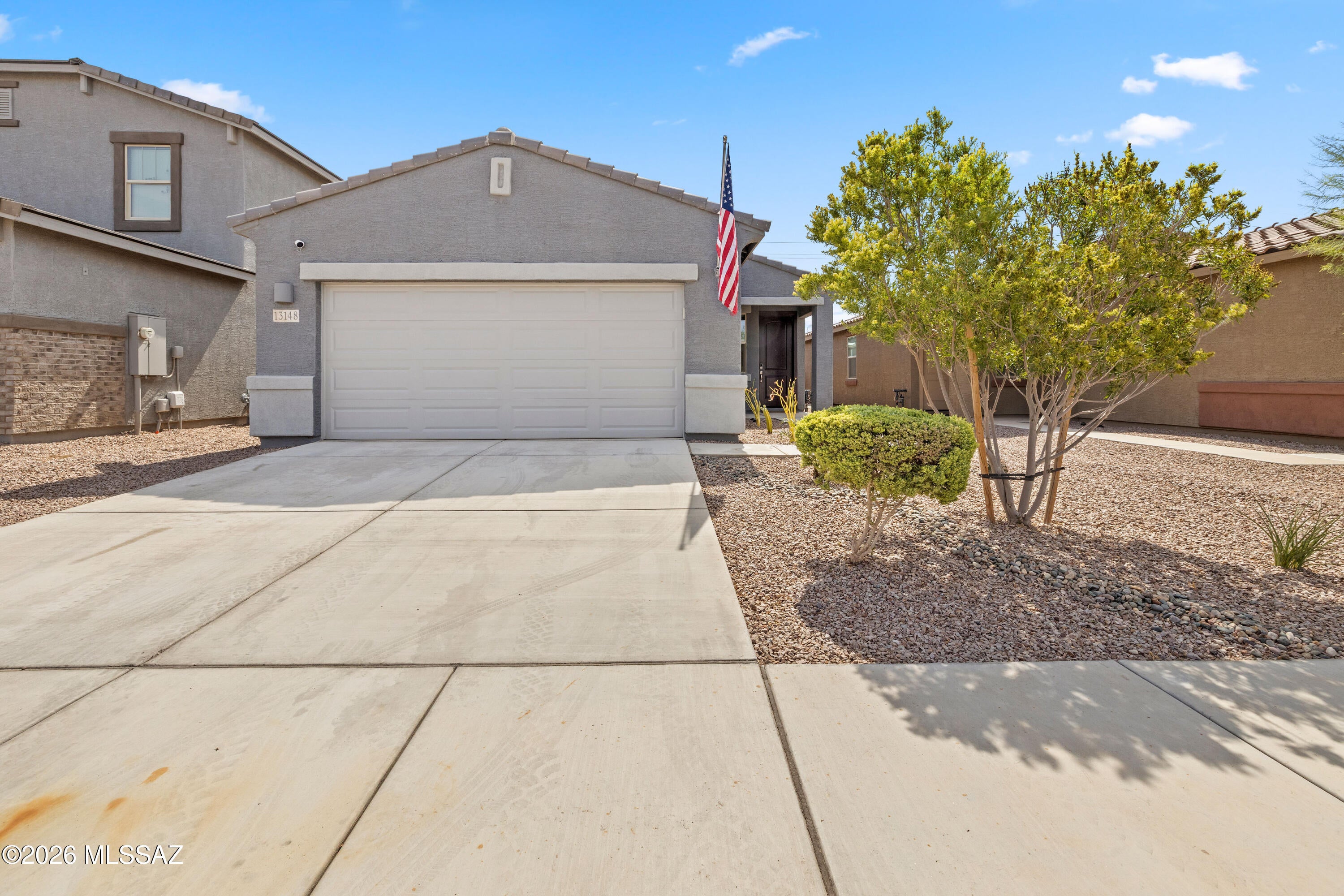 Better than new and thoughtfully upgraded throughout! Why wait months for new construction when you can move into a nearly new home with the upgrades already done for you? This move-in-ready 3-bedroom, 2-bath home offers the perfect blend of modern style, comfort, and functionality.

The open-concept floor plan is designed for everyday living and entertaining, with a spacious kitchen that flows seamlessly into the dining and living areas. The split-bedroom layout offers added privacy, featuring a spacious primary suite with a walk-in closet and private bath, while two additional bedrooms provide plenty of space for family, guests, or a home office. A built-in surround sound system adds an elevated touch, creating the perfect atmosphere for movie nights, entertaining, or simply enjoying your favorite music throughout the home.

Enjoy the privacy of no direct rear neighbors and a low-maintenance backyard finished with gravel, making it easy to enjoy as is or offering the perfect blank canvas to create the backyard oasis you've always envisioned.

The garage is truly a dream space, finished with an upgraded modular garage tile floor that conveys with the home, creating the perfect setup for a home gym, workshop, hobby space, or simply keeping your garage looking clean and organized. The home also features additional attic access, providing convenient extra storage for seasonal items and more.

Conveniently located in Rancho Marana with easy access to I-10, shopping, dining, schools, and everyday conveniences, this home offers all the benefits of nearly new construction--without the wait or the expense of completing the upgrades yourself.

Move in, unpack, and enjoy a home that's already been thoughtfully upgraded for you.