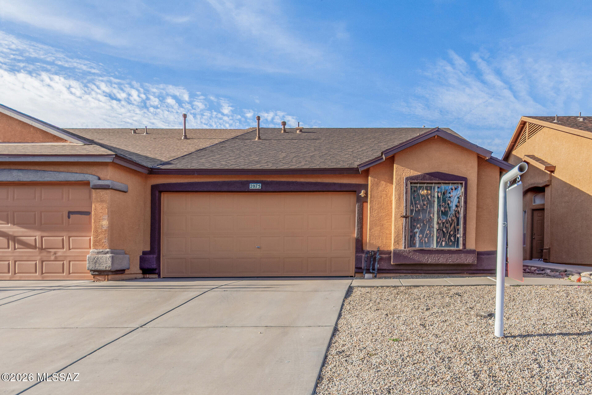Now available in the desirable Tres Pueblos neighborhood of South Tucson! This refreshed, move-in ready townhome features 3 bedrooms and 2 bathrooms with thoughtful updates throughout. Enjoy a great room floor plan with an open, flowing layout, tile flooring throughout, and a spacious kitchen with ample cabinetry. Year-round comfort is ensured with a brand new AC system, along with added upgrades including a new garbage disposal and updated kitchen and bathroom faucets. The home also offers an attached 2-car garage and a private backyard space, enhanced by recent landscape cleanup--perfect for easy outdoor enjoyment. A must-see opportunity!