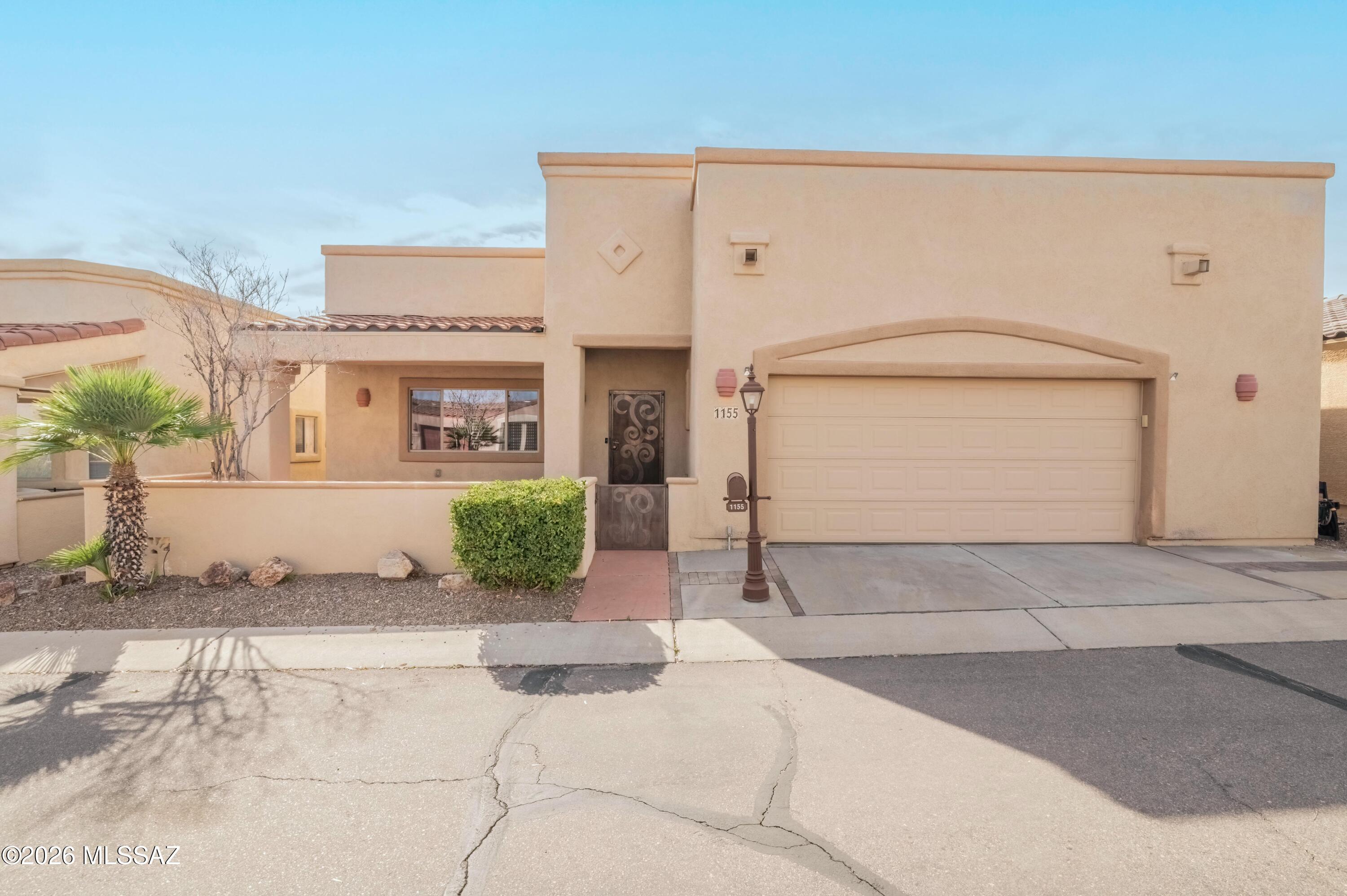 Come to Sahuarita and experience gated Rancho Resort. Your affordable 55 plus community. Then come look at this 2 bedroom 2 bath home with a gated courtyard entry. Tile flooring throughout the main living areas and wood look floors in the bedrooms. No carpet! Corner gas fireplace, huge, open great room, dining area and breakfast bar. Granite counters, stainless appliances and refrigerator stays. Laundry room leading to garage has cabinets, sink and includes the washer and dryer. Guest bath is light and bright and right off of the guest bedroom. Primary suite has double vanity, soaking tub, separate shower and large walk in closet. So many community activities to choose from! Close to I-10, Green Valley, and just a short drive to Tucson.